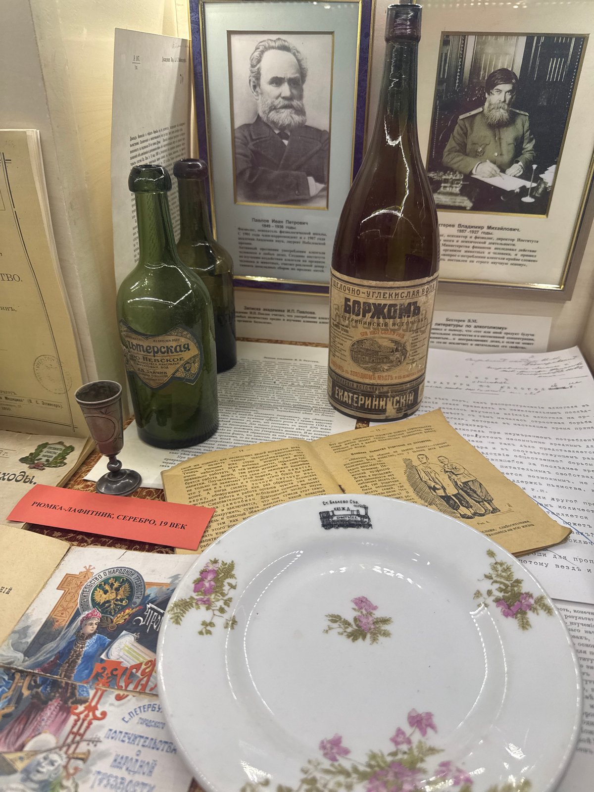 Visitor documents historical artifacts at Saint Petersburg museum exhibition