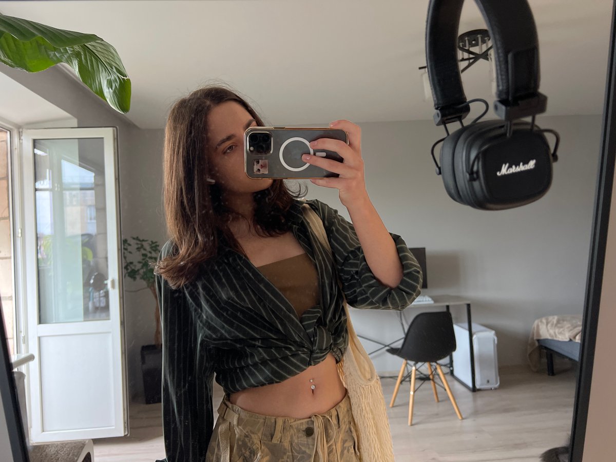 Mirror selfie series in a Ternopil bedroom, styled outfit