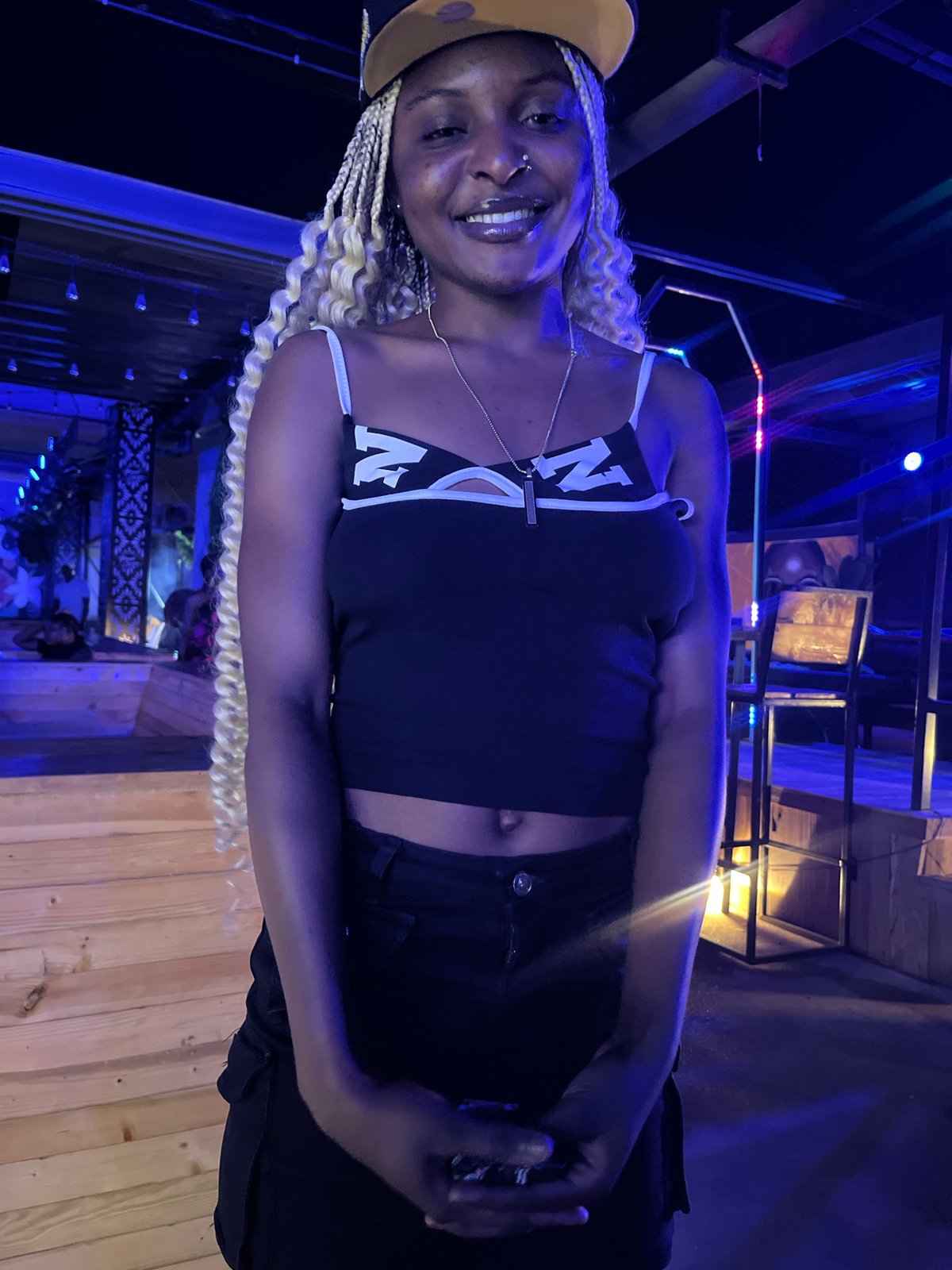 Evening at a neon-lit bar and lounge in Howayi, Nigeria