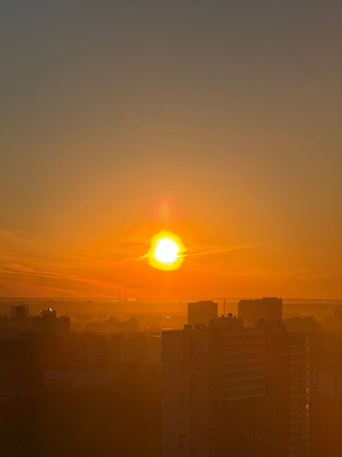 Orange sunrise observed over Perm, Russia skyline