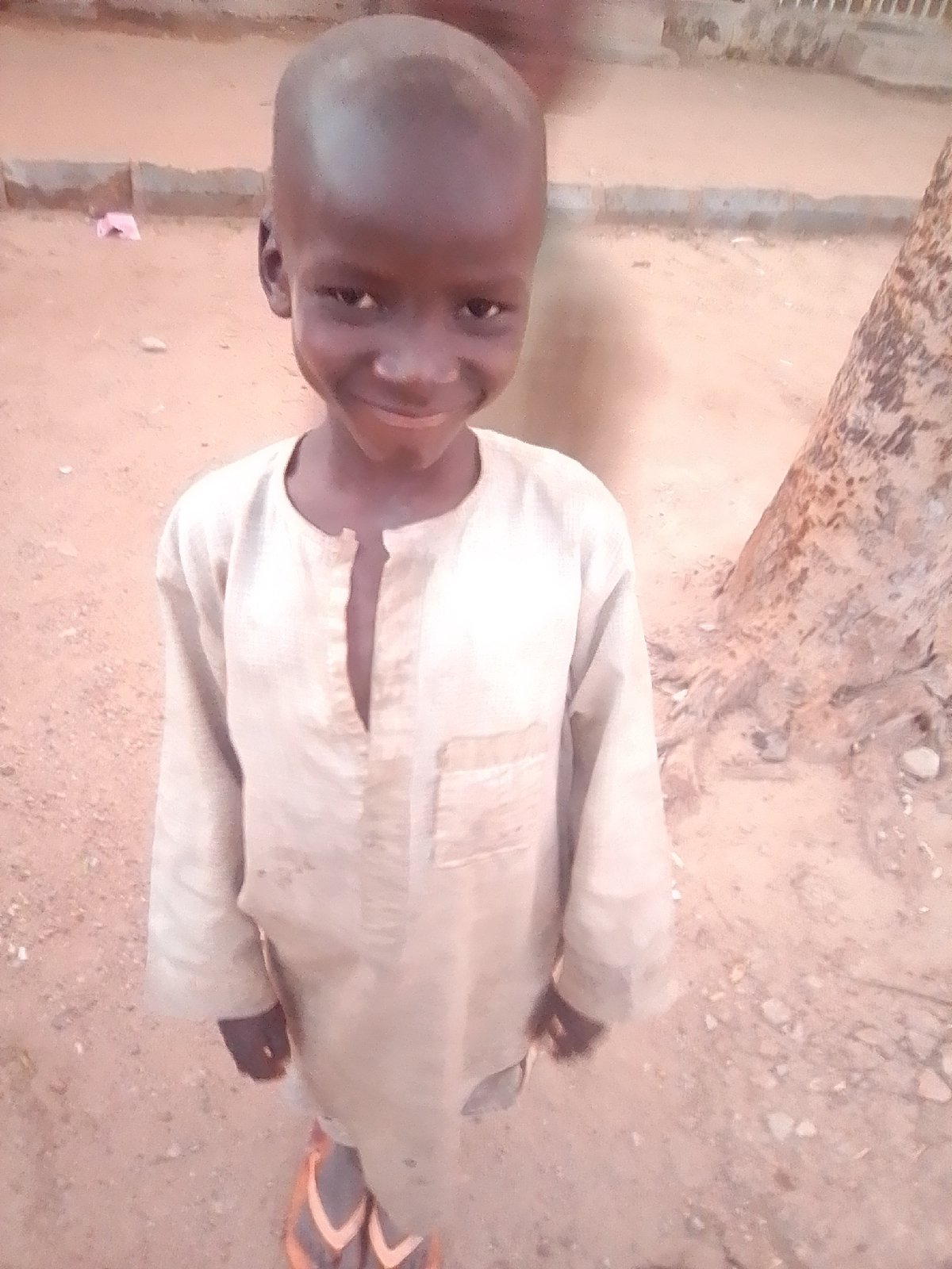 Everyday street life in Gombe at golden hour