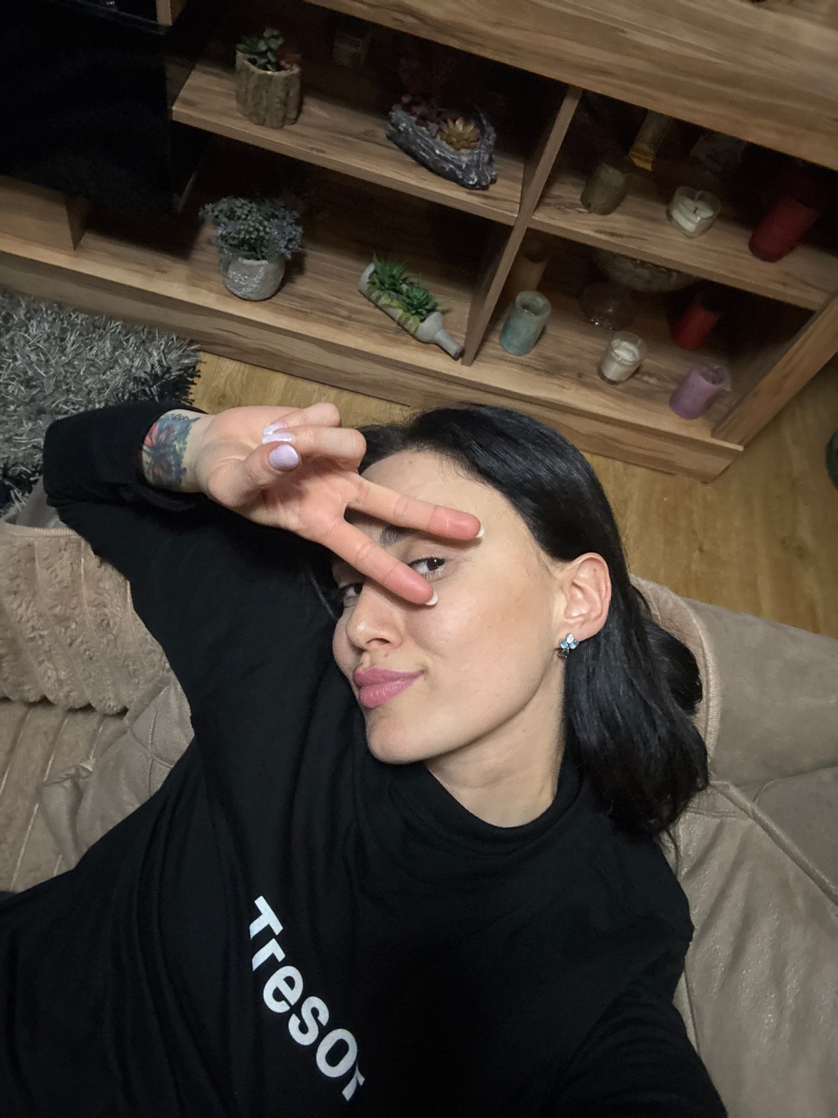 Woman photographed relaxing on couch in Tbilisi residence