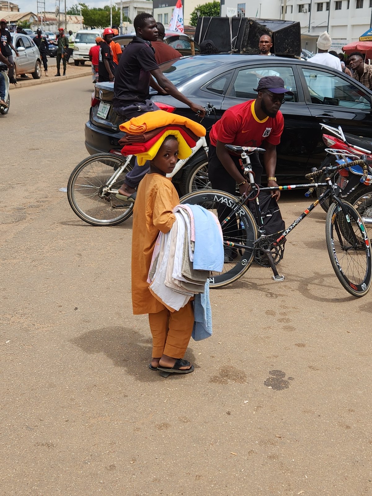 Organized group in orange gathers on the streets of Jos