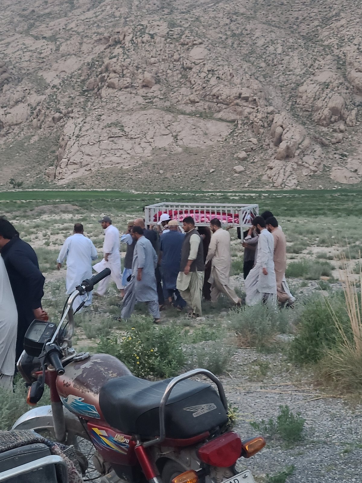 Hundreds gather at twilight in mountainous Quetta