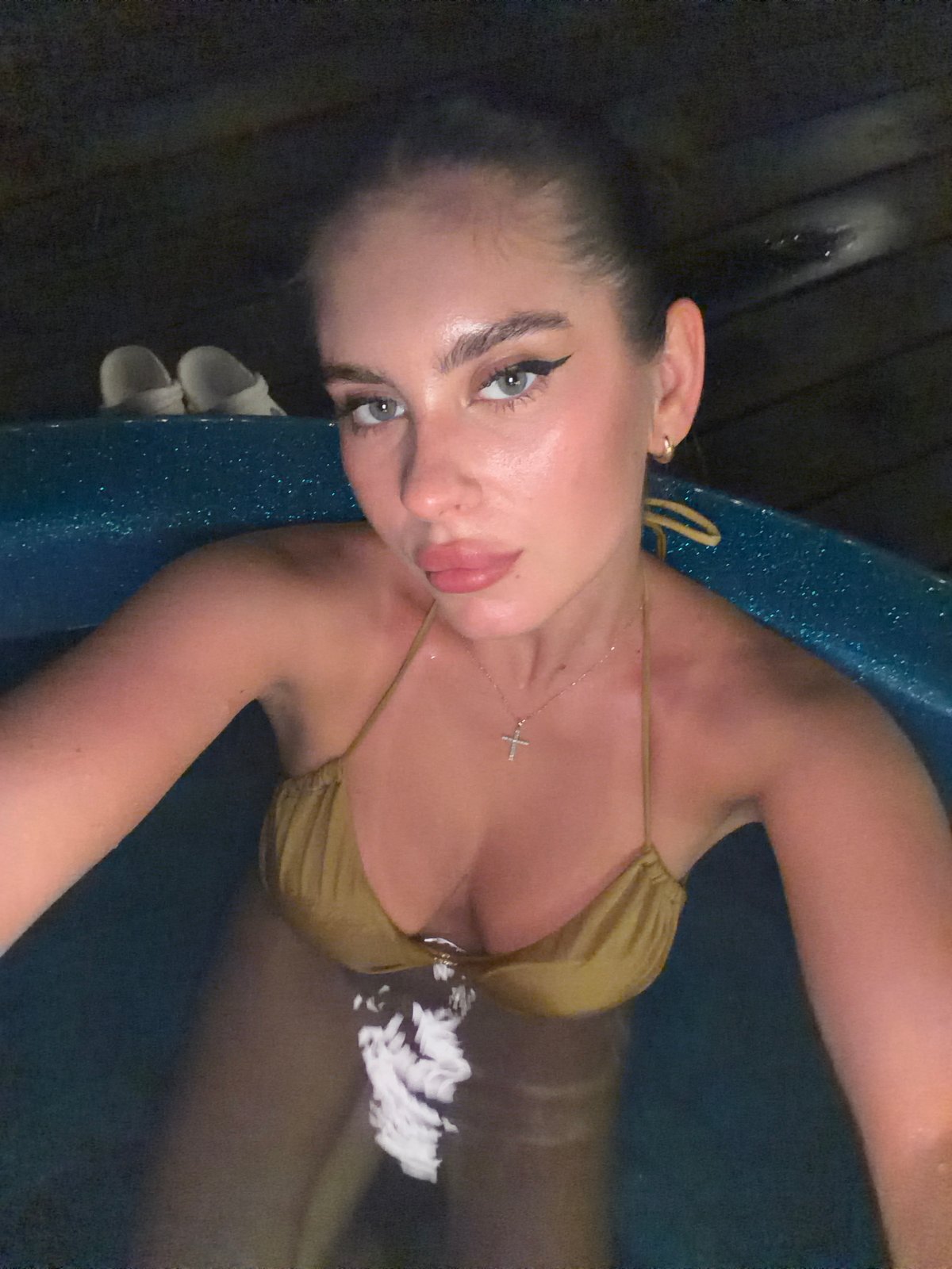 Woman enjoys cabin retreat with hot tub in Berezovka forest