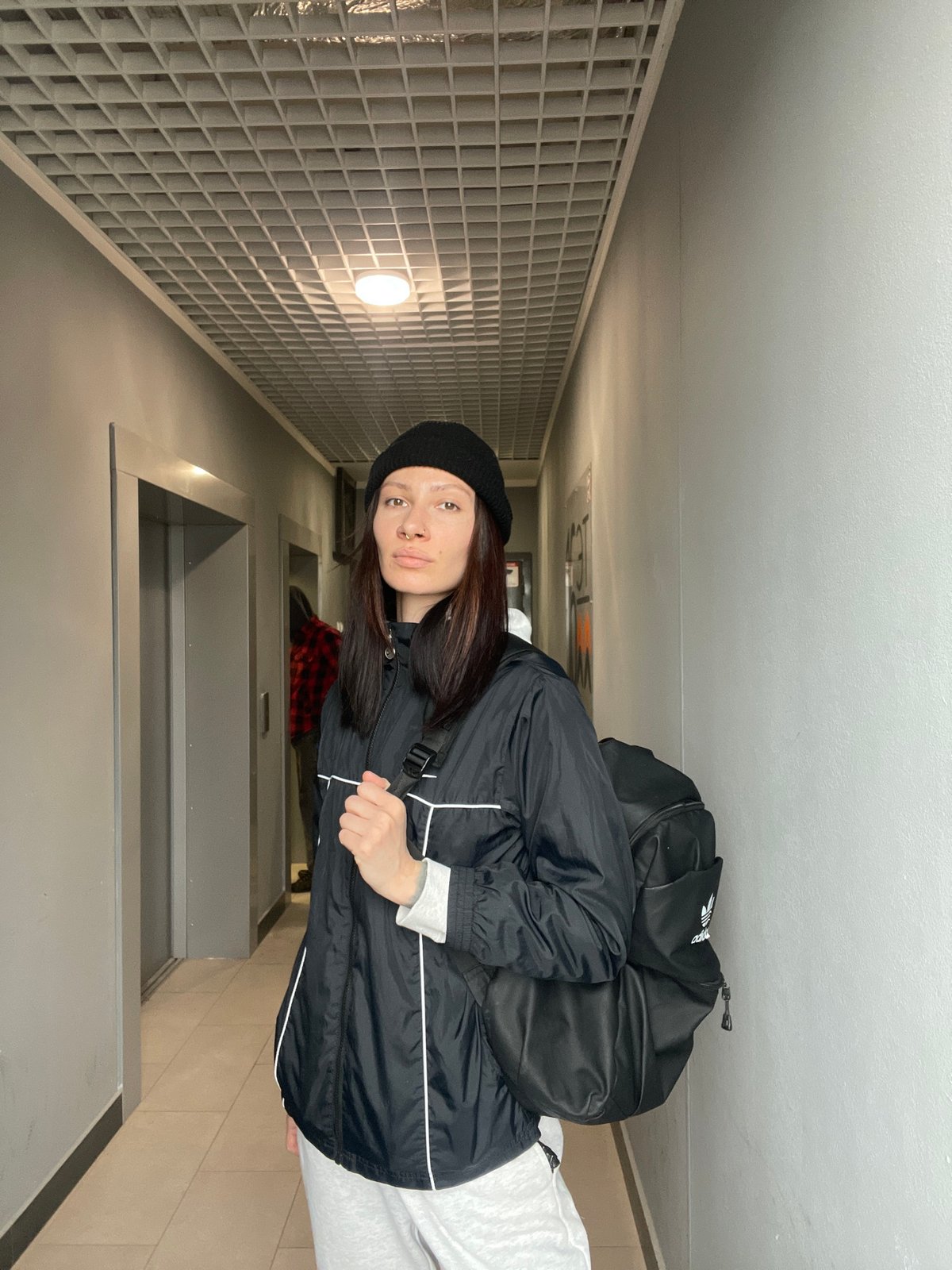 Woman takes selfie in building entrance, Izhevsk