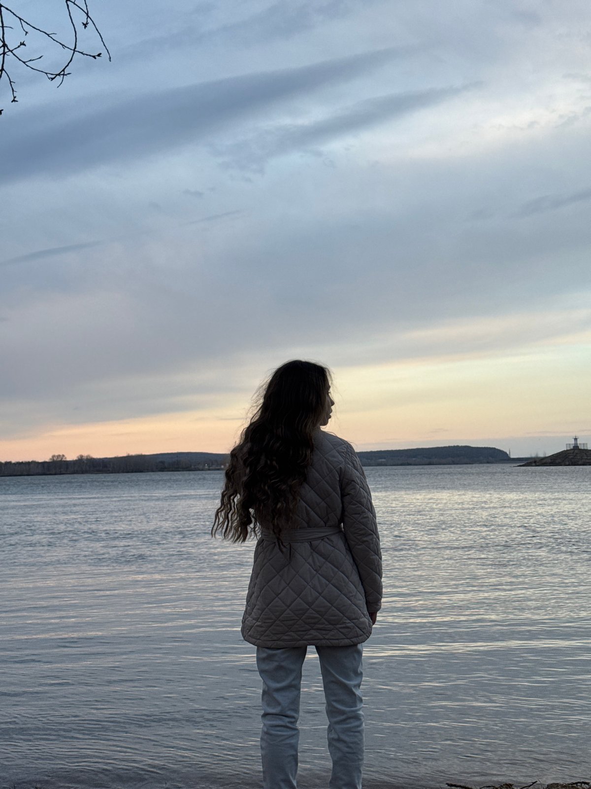 Woman spends afternoon by Kama River in Chaikovsky, Russia