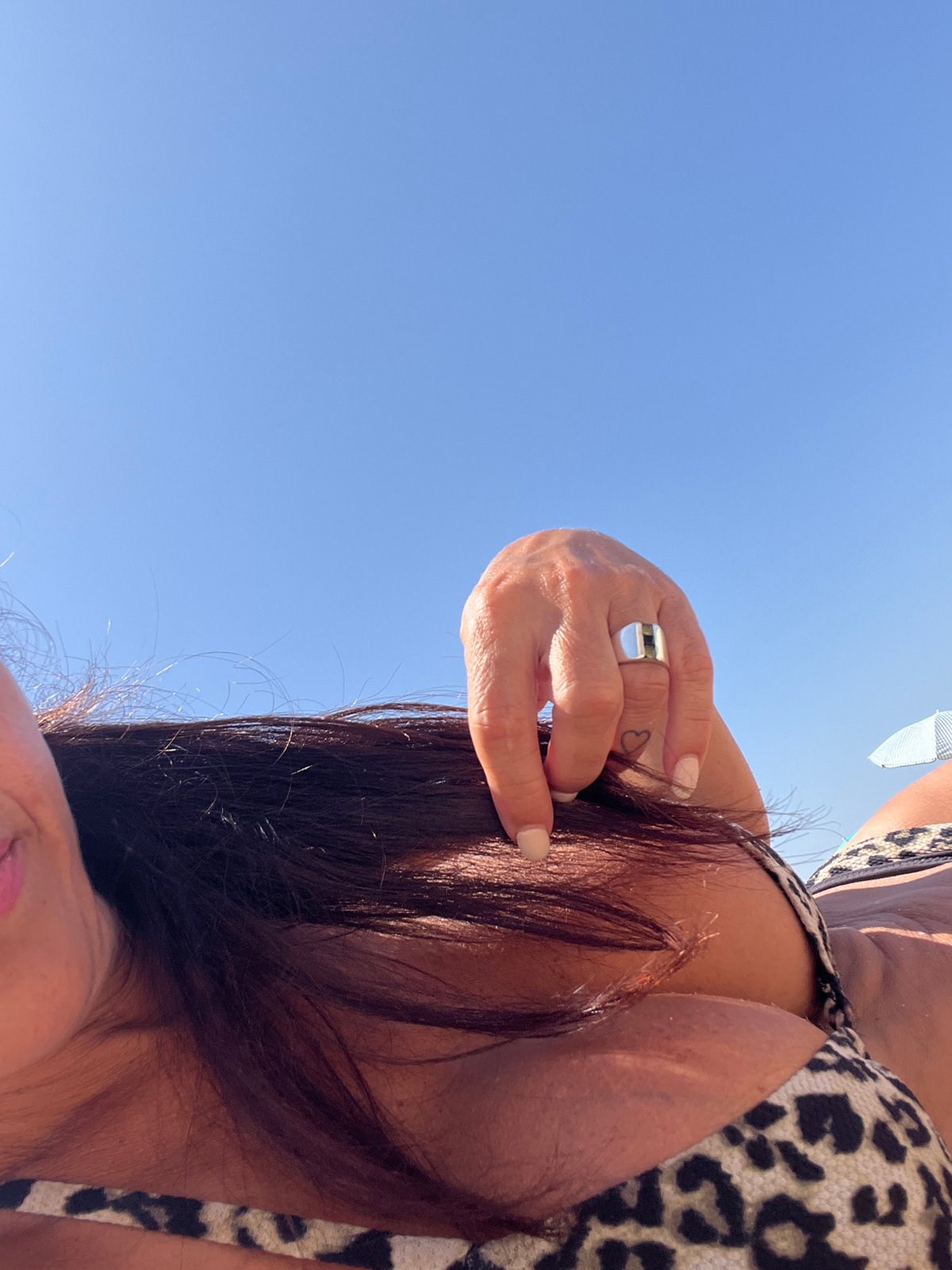 Lying back on a Portuguese beach under clear blue skies