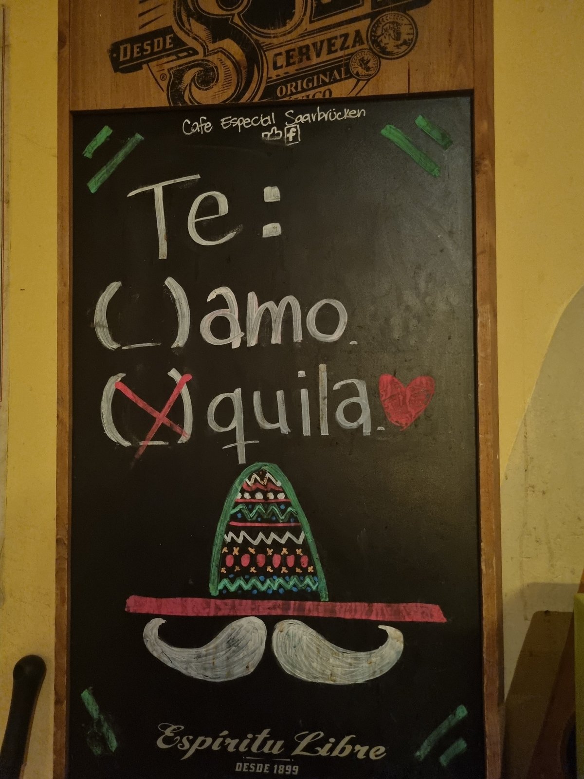 Evening bar scenes documented in Saarbrücken featuring chalkboard menu