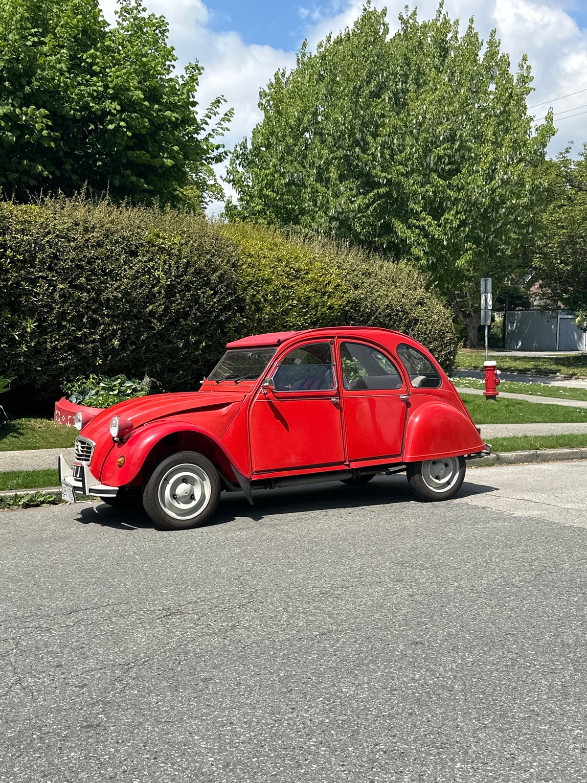 Red Citroen 2CV spotted parked on New Westminster street