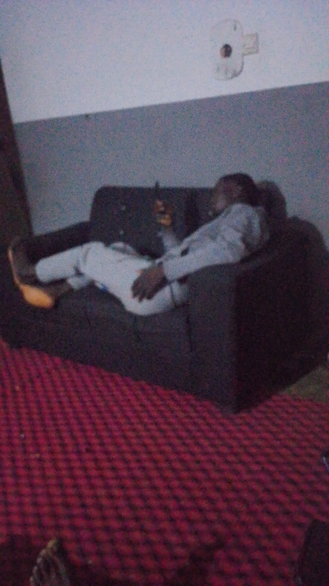 Evening domestic life captured in dimly lit living room