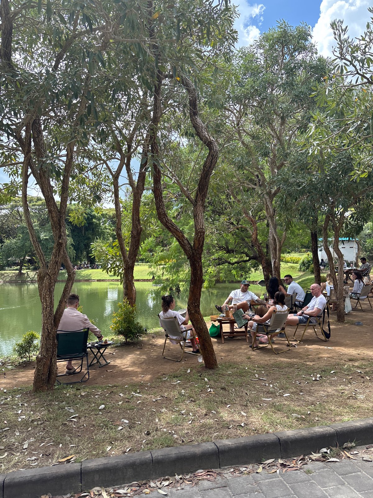 Morning lakeside gathering with dining documented in Kuta Selatan