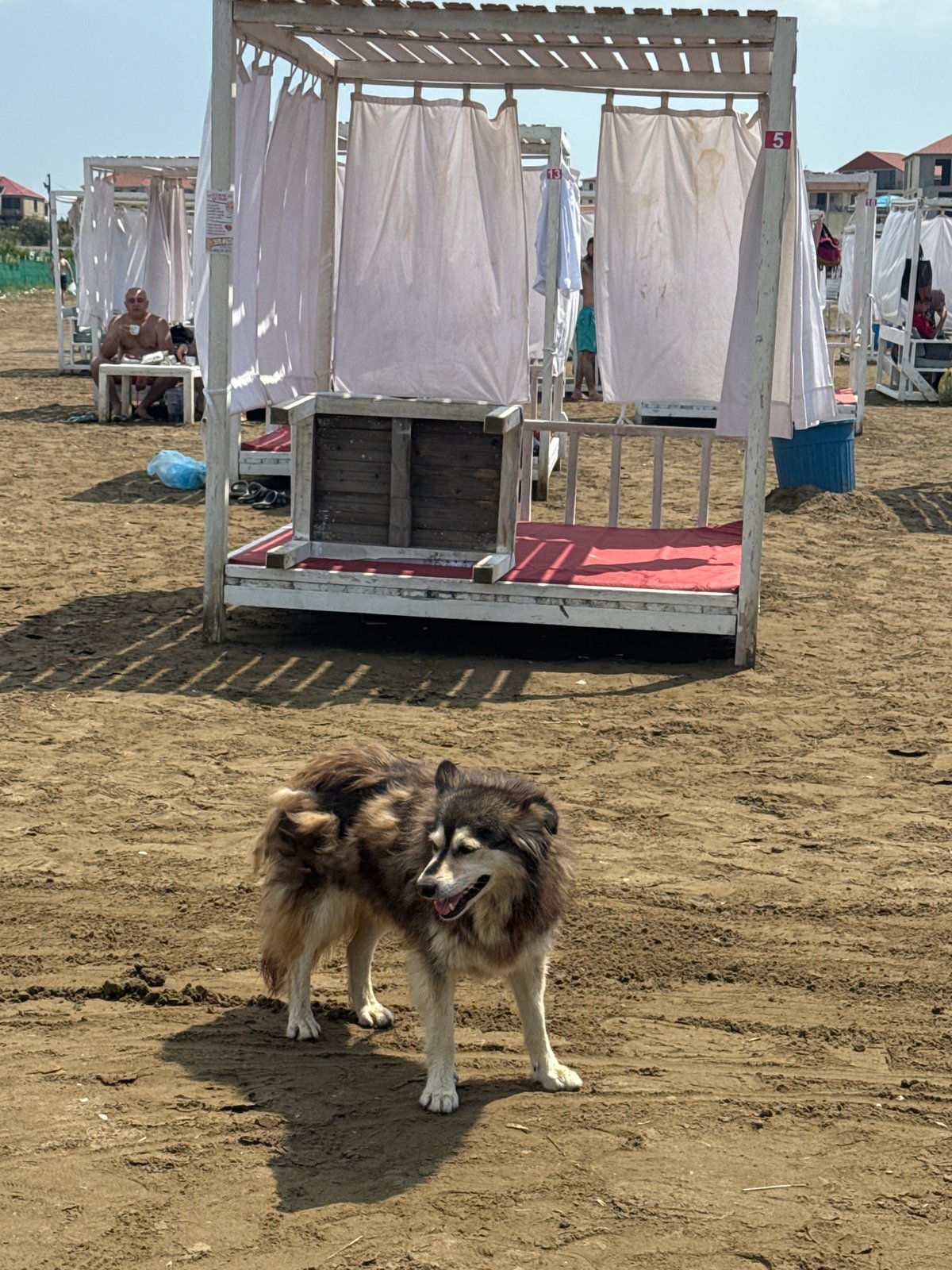 Caspian beach resort morning, cabanas and clouds in Azerbaijan
