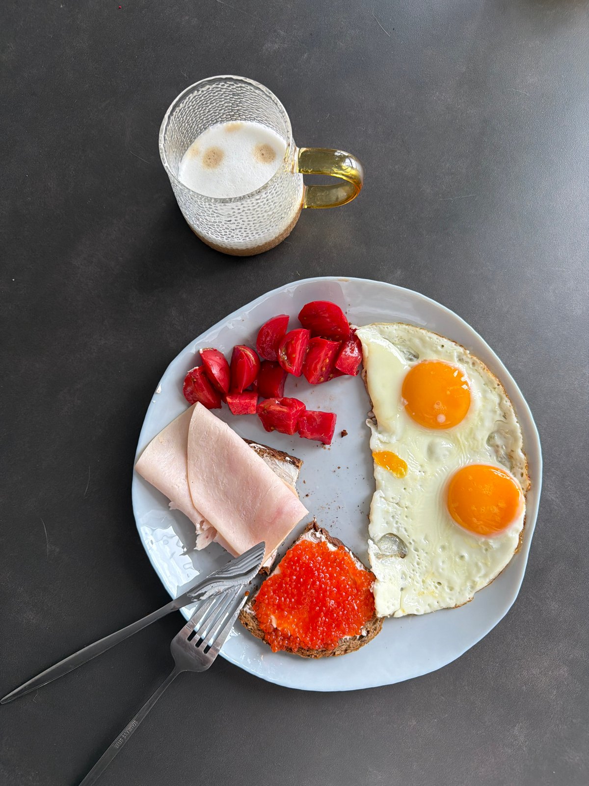 Breakfast meal with eggs, caviar bread documented Monday morning
