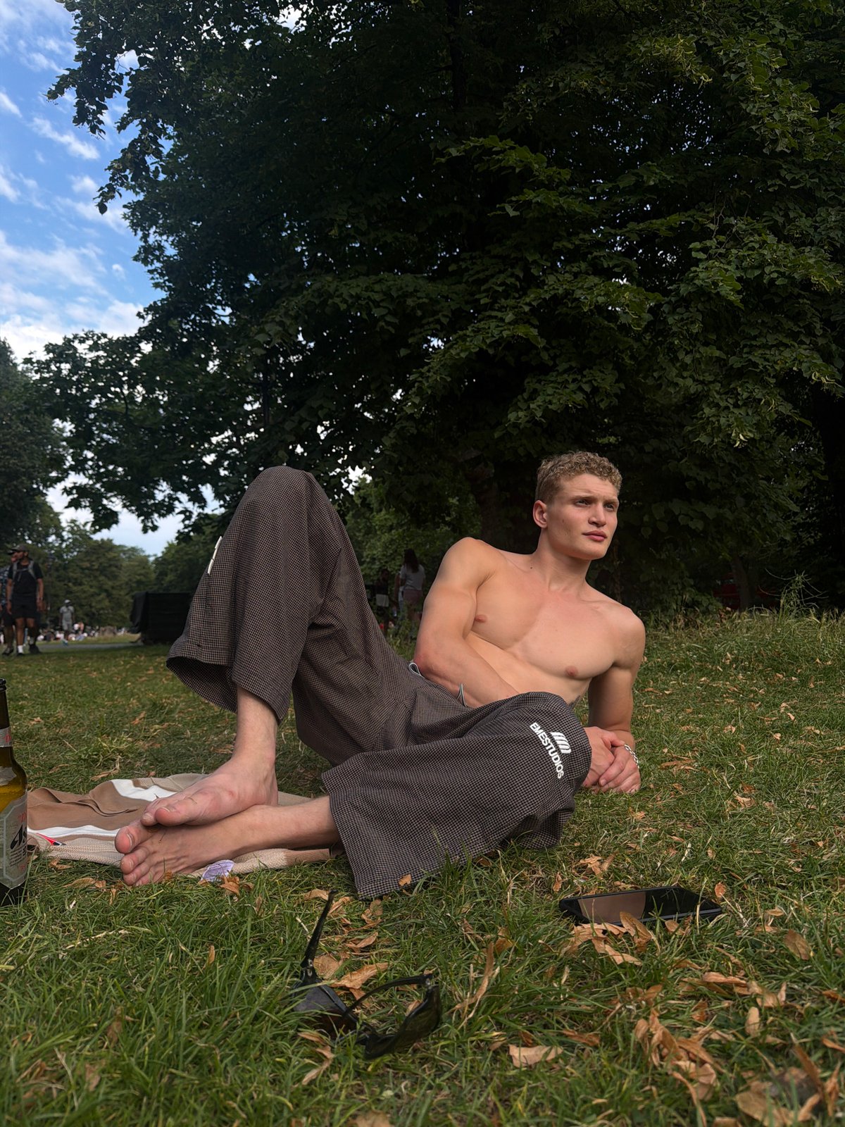 Lazy summer afternoon in a London park near a flower shop