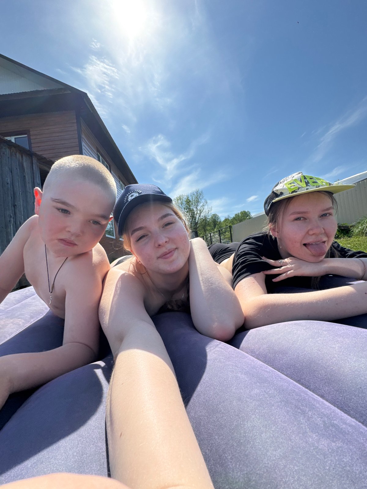Family enjoys inflatable mattresses in Russian backyard