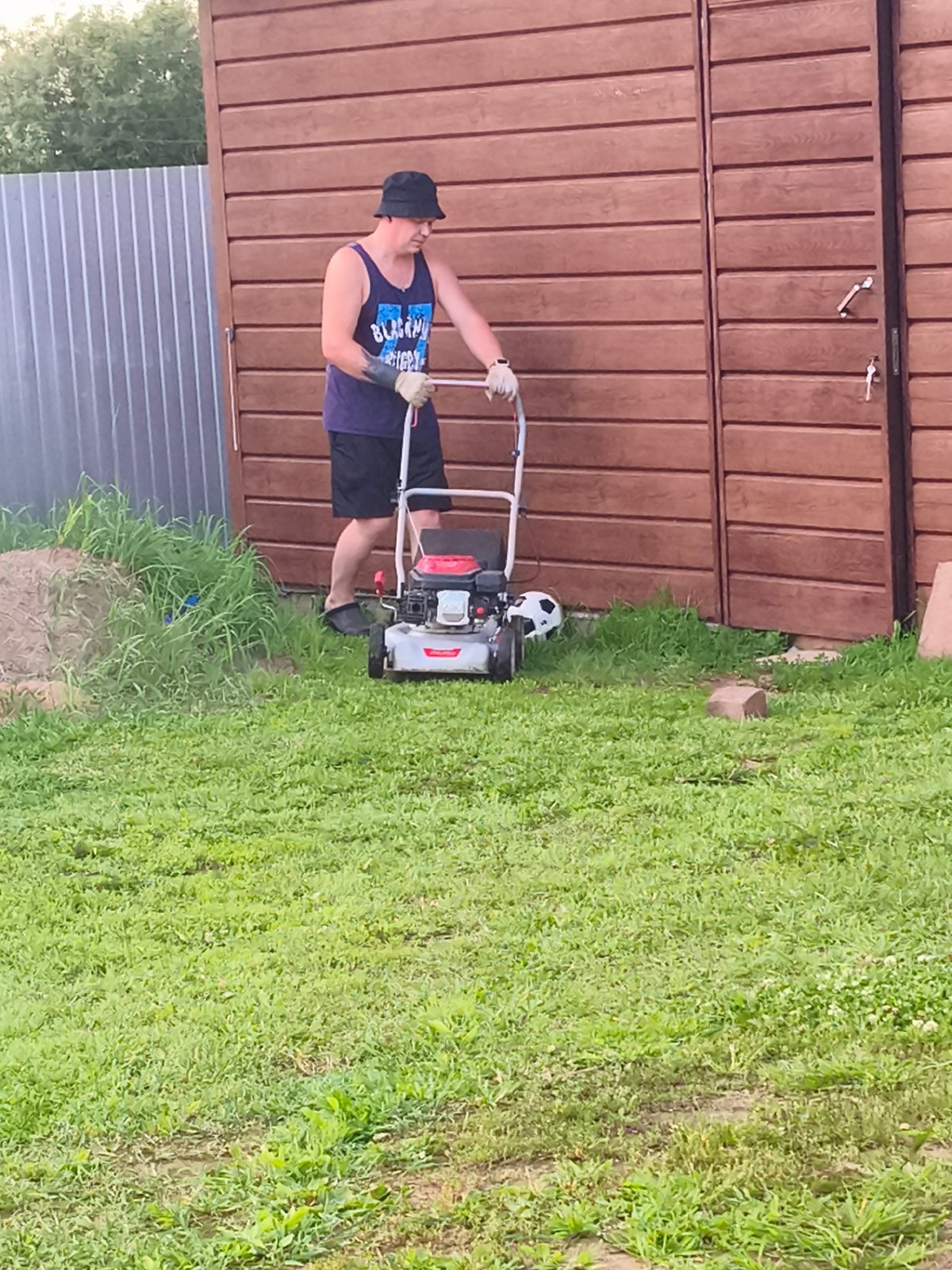 Casual evening in a Russian village — lawn mowing and portraits