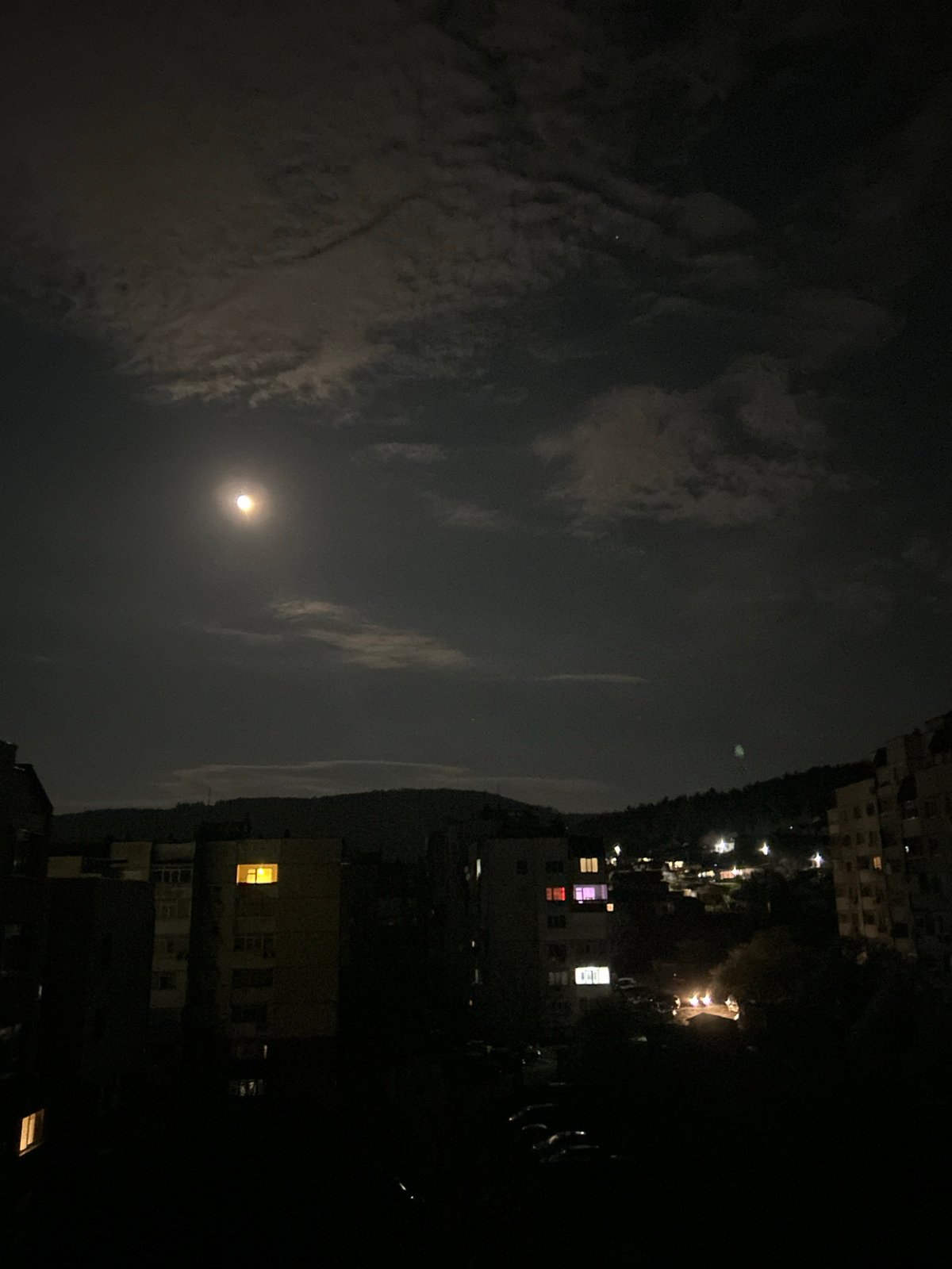 Bright moon observed through cloudy night sky in Shumen