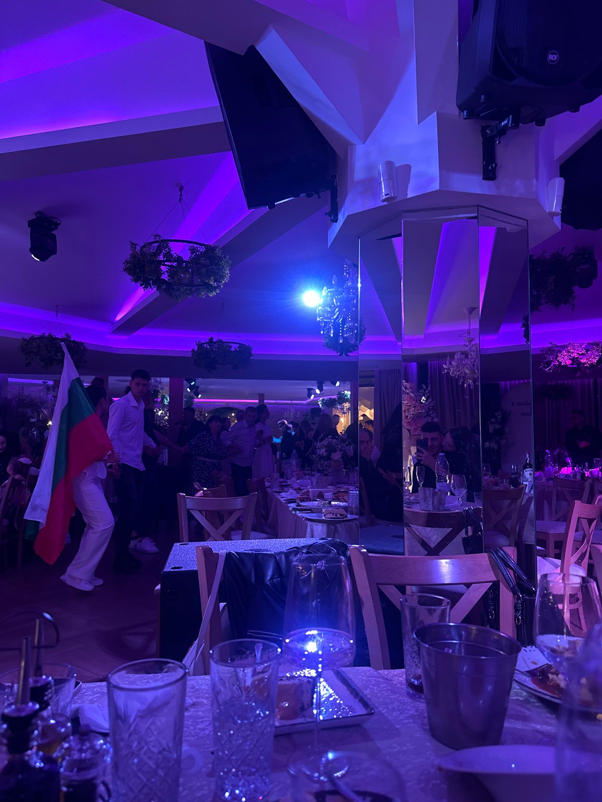 Reception event underway in Blagoevgrad hall with violet lighting