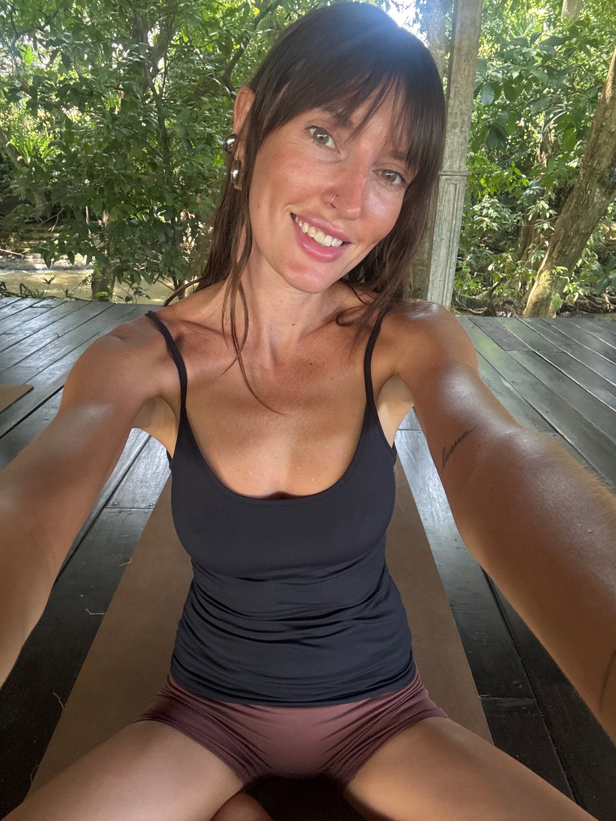 Early morning yoga session held at wooden studio in Mengwi
