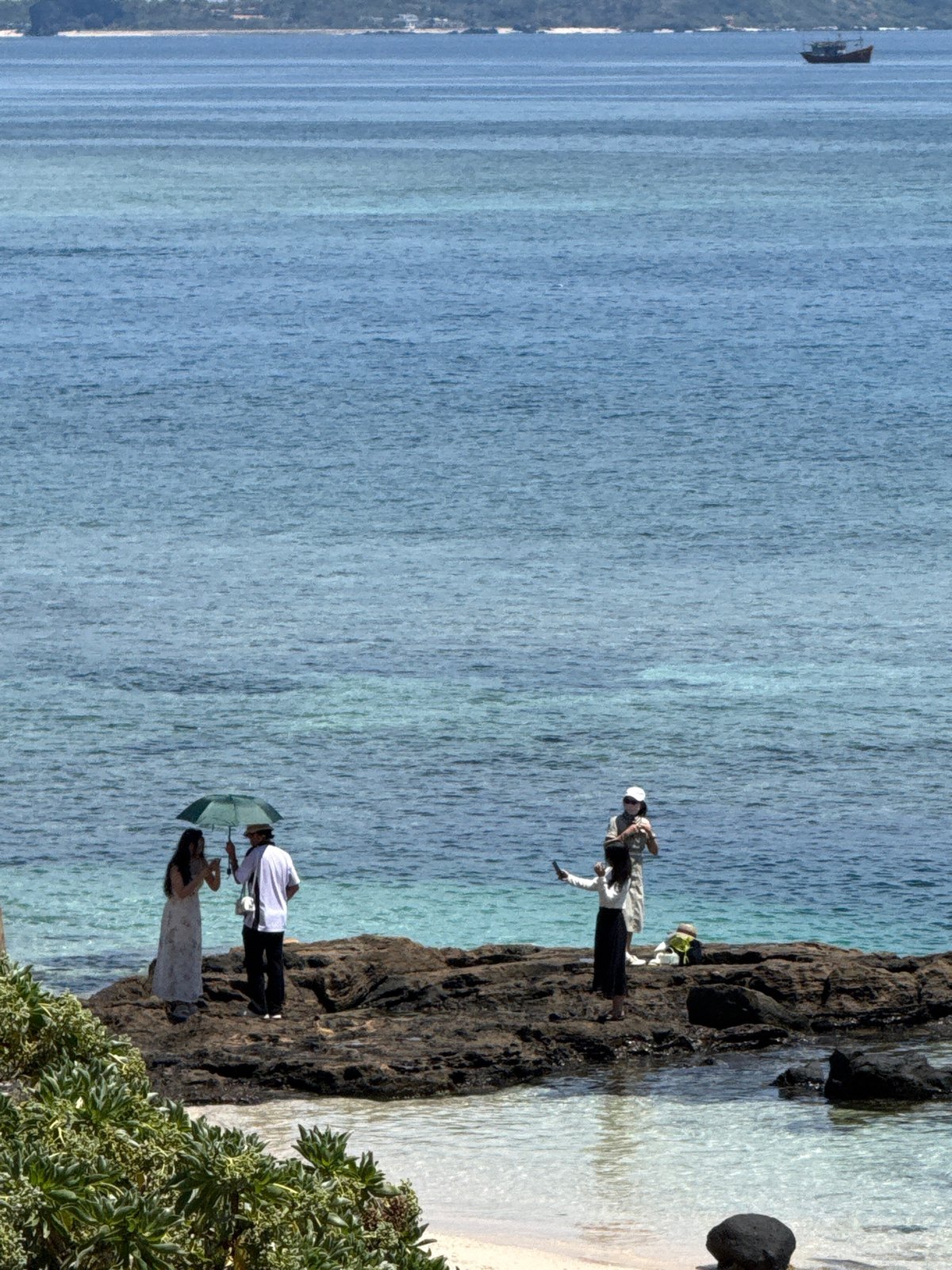 Lý Sơn Island: coastal shrine and seascape on a clear morning