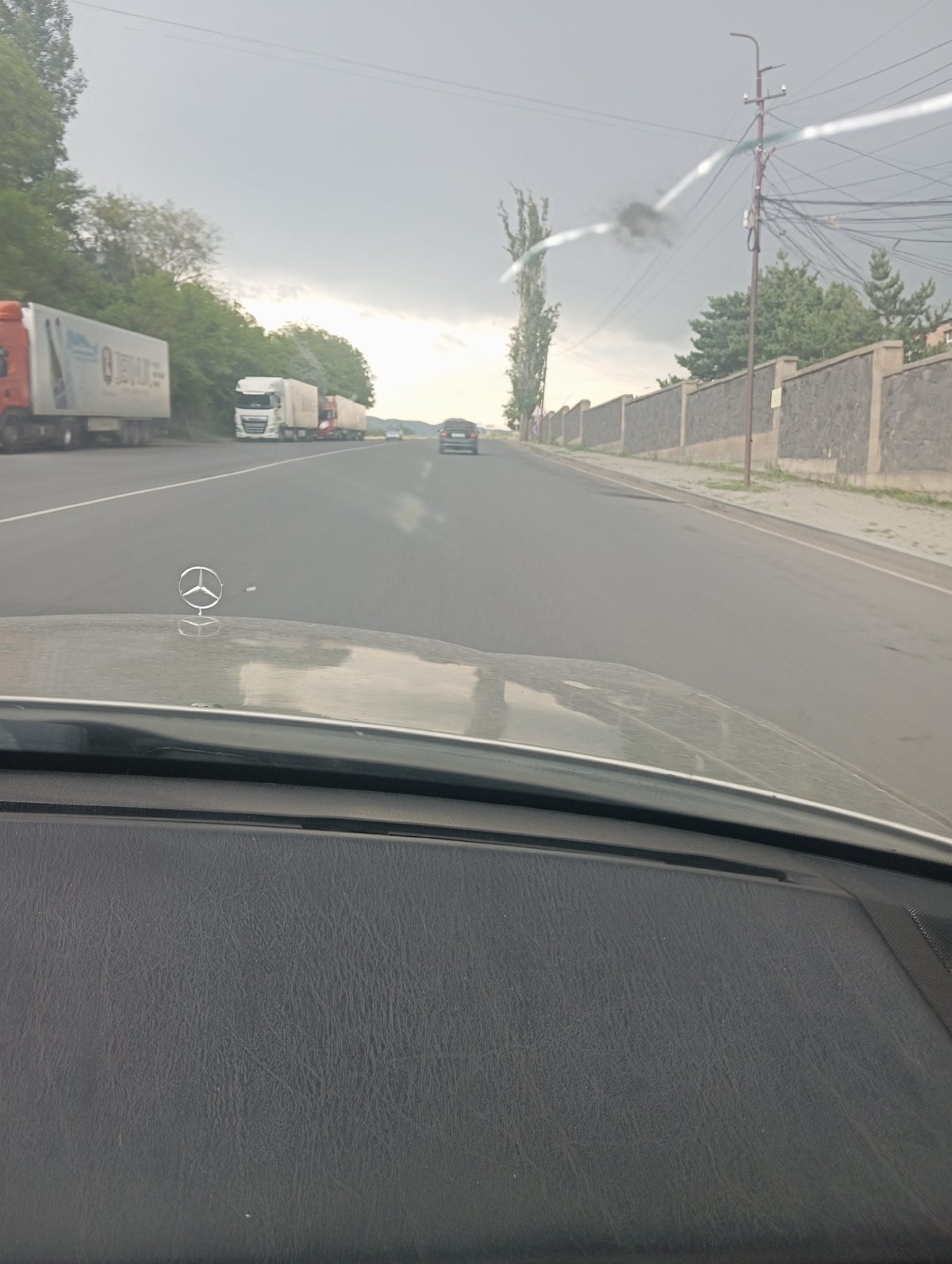 Rainy morning pause in Yeghegnadzor: roads, coffee, and grapevine patios