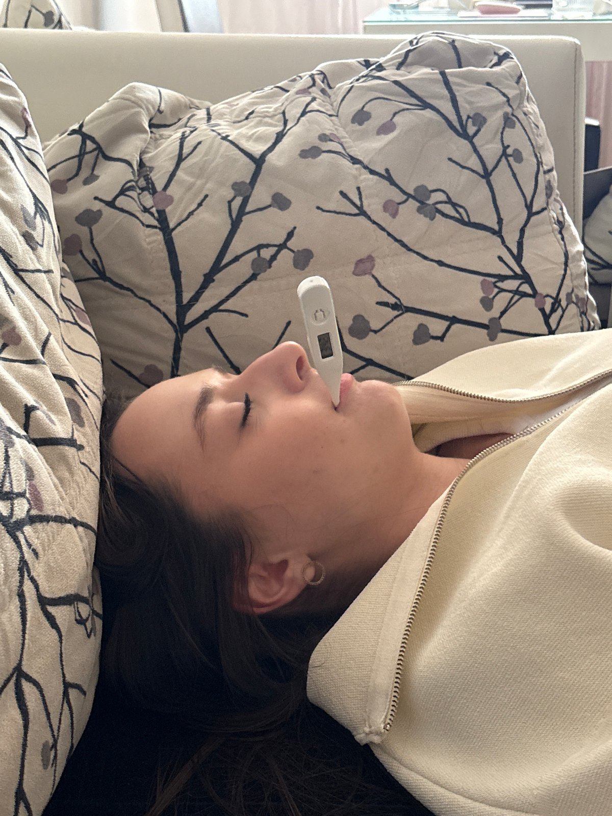 Woman takes temperature reading while resting in Kragujevac