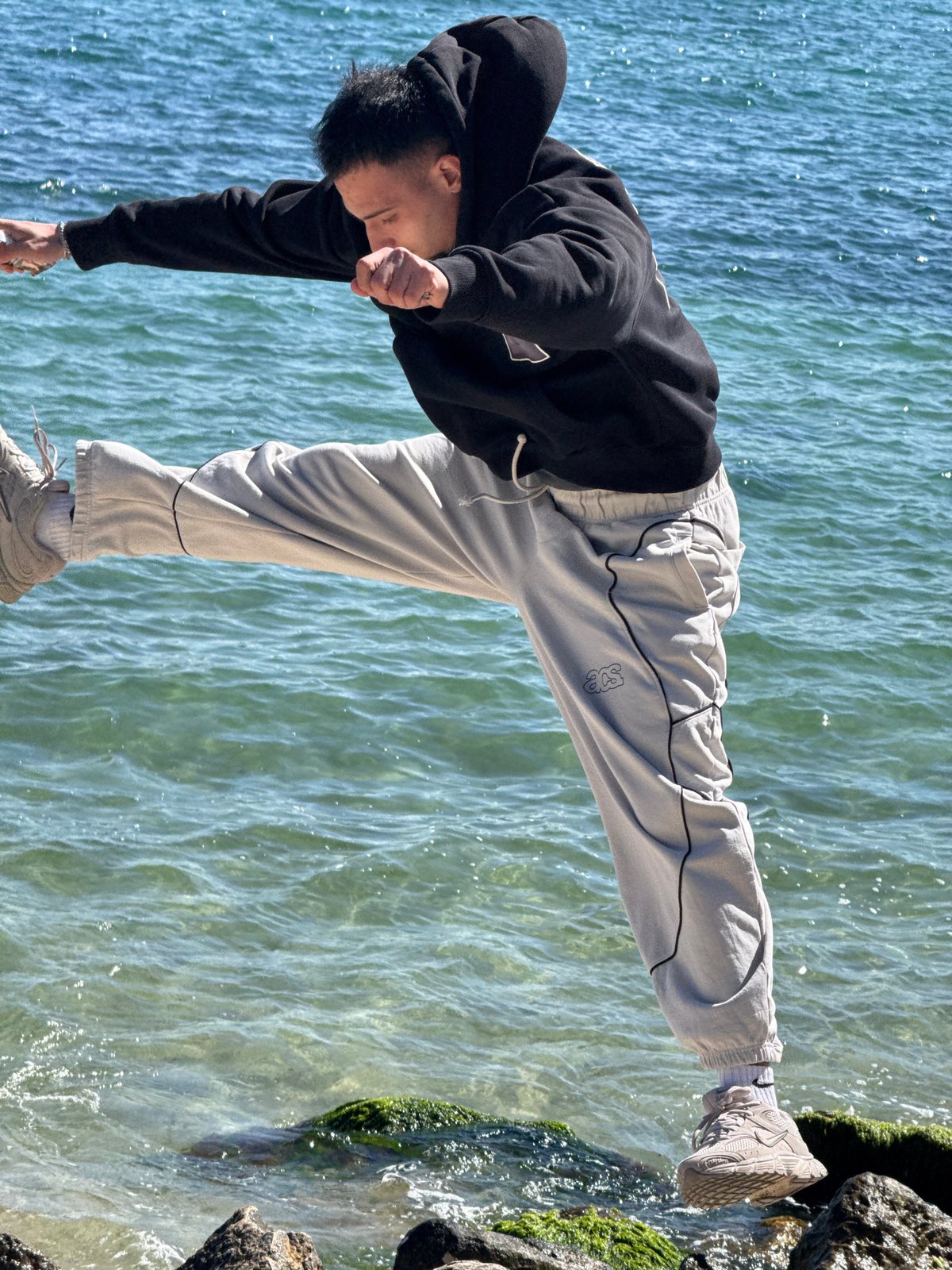 Young man performs coastal acrobatics in sunny Varna, Bulgaria