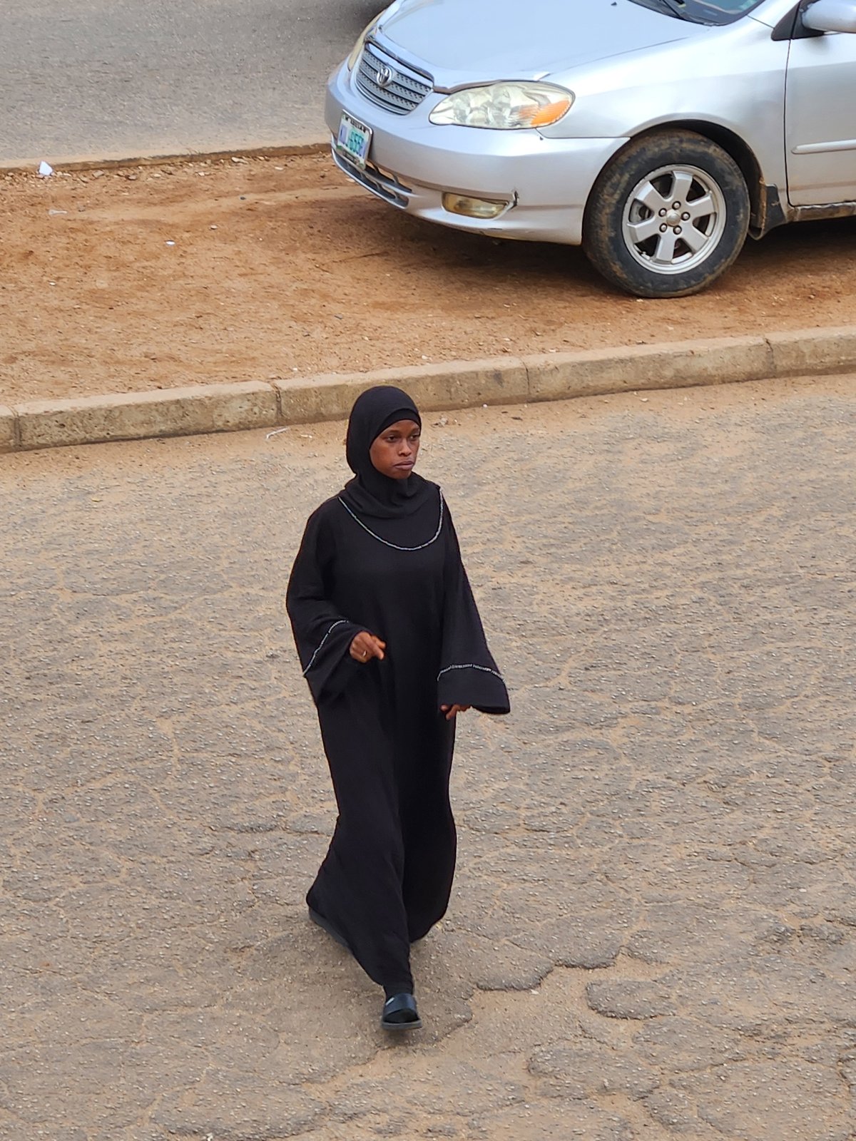 Urban street activity documented amid military presence