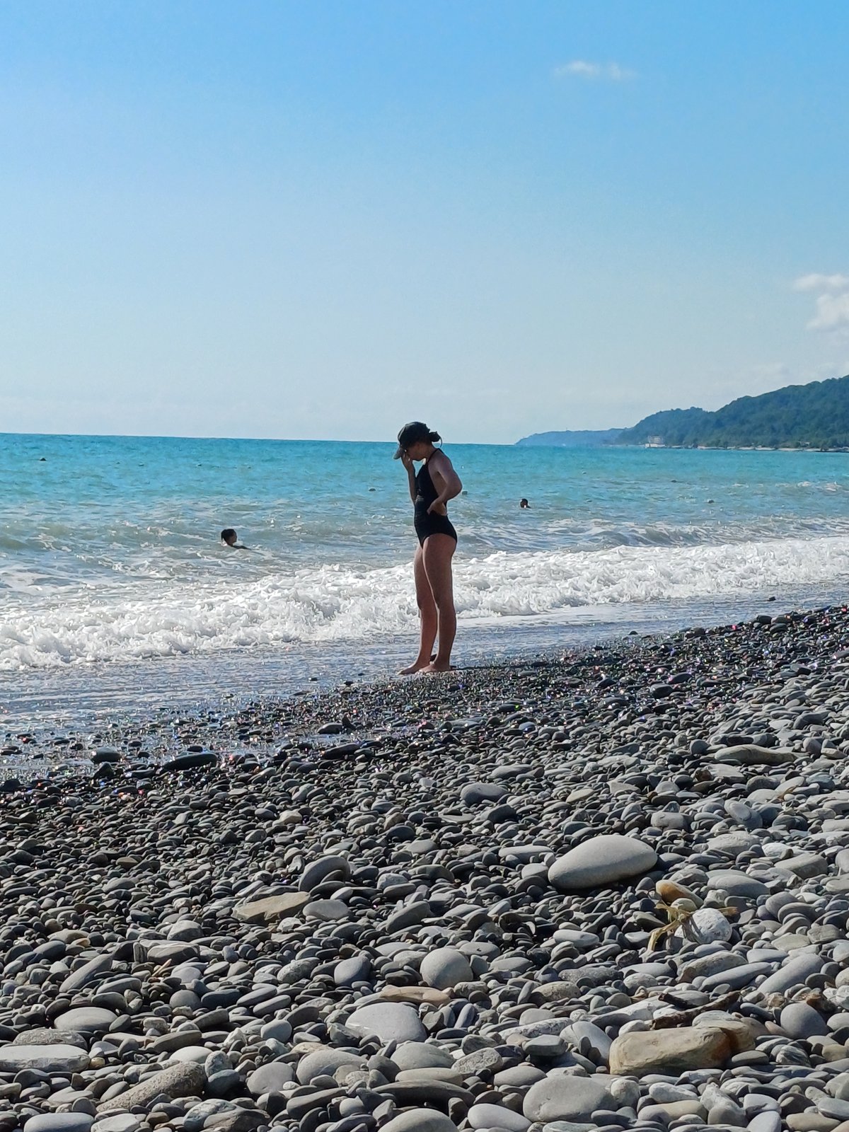 Summer beach day at Sochi's Black Sea pebble shore
