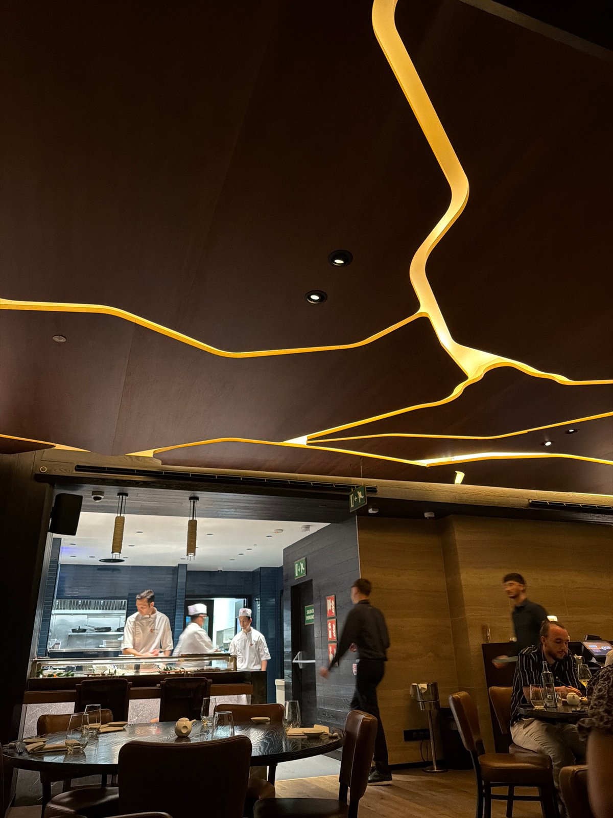Dinner at a sleek Barcelona restaurant, city views after