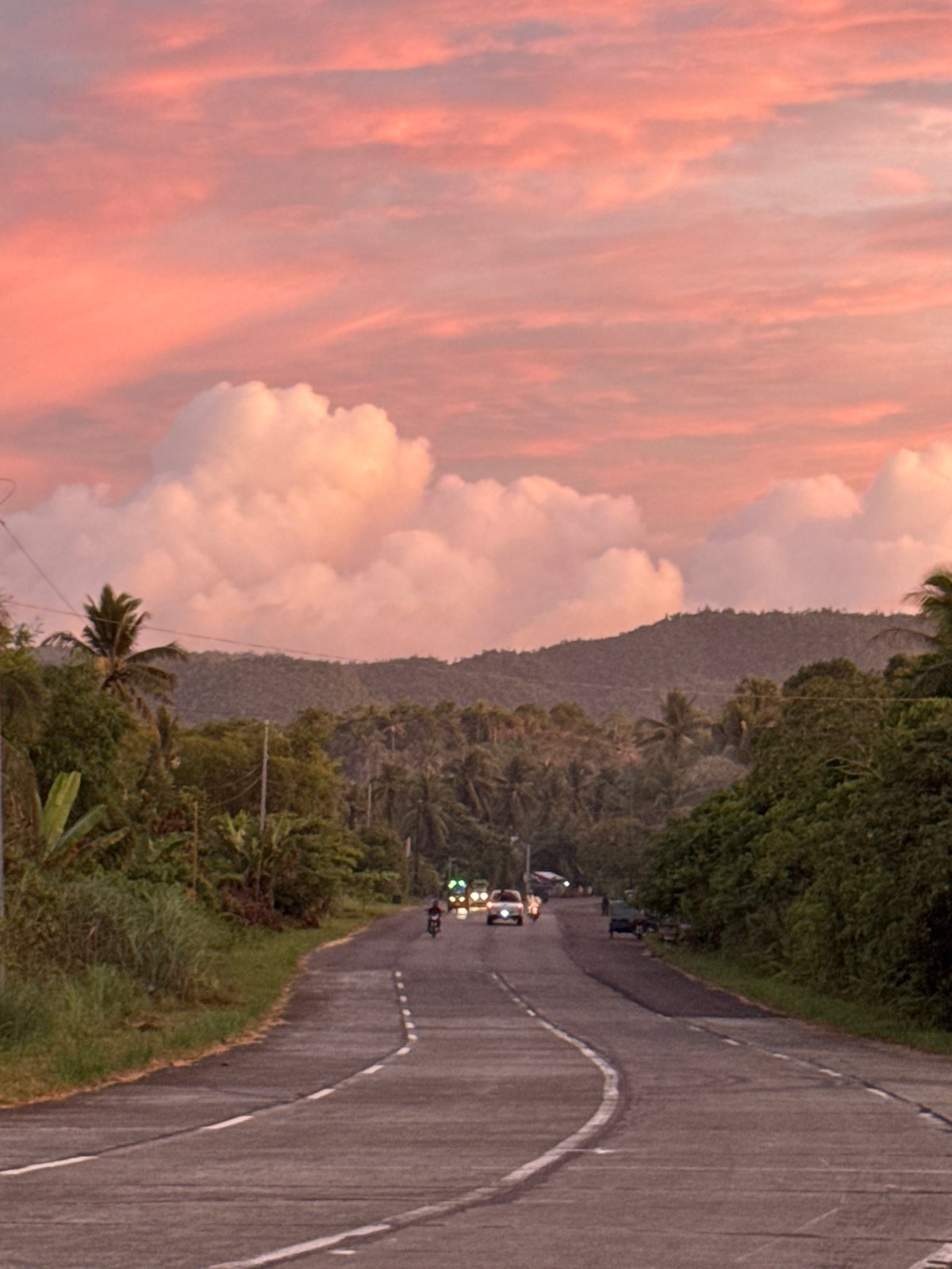 Sunset clouds observed over curved road in Pilar, Philippines