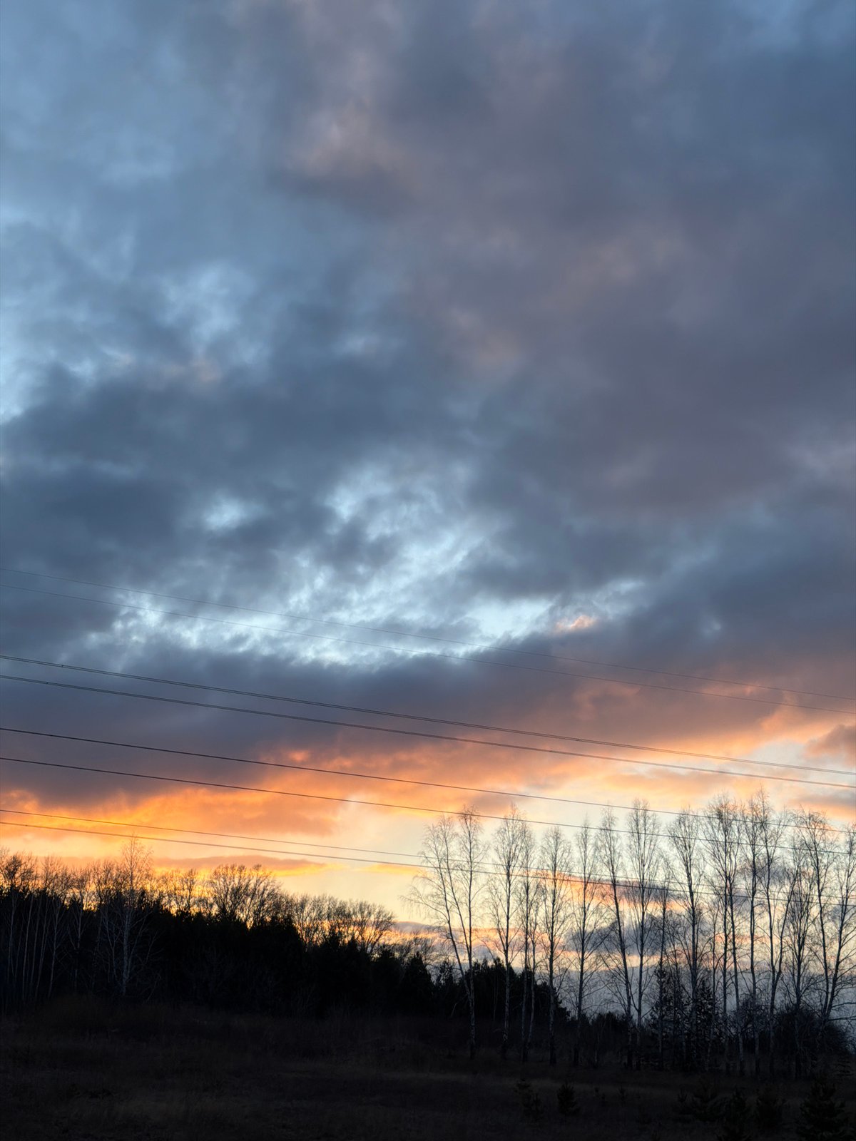 Dramatic sunset observed over Krasnoyarsk landscape with contrasting clouds