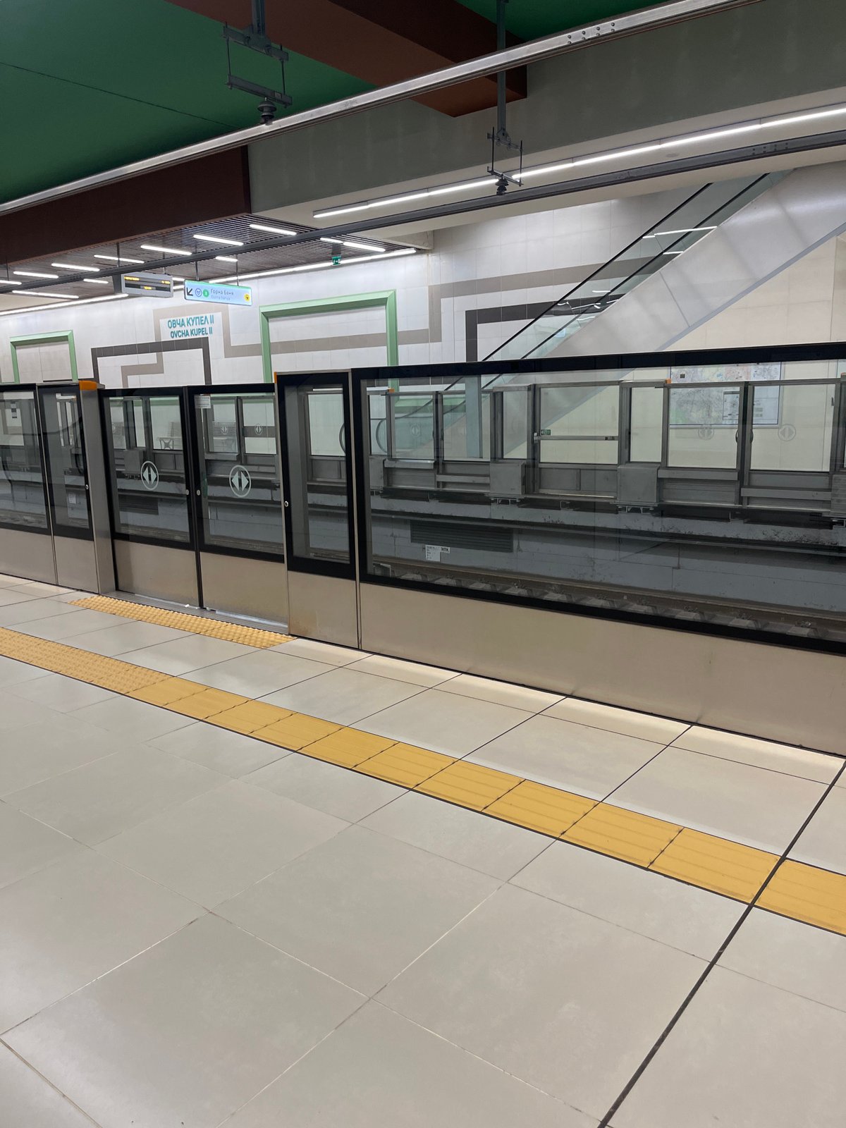 Morning observations capture Sofia subway platform and Bitcoin trading workspace