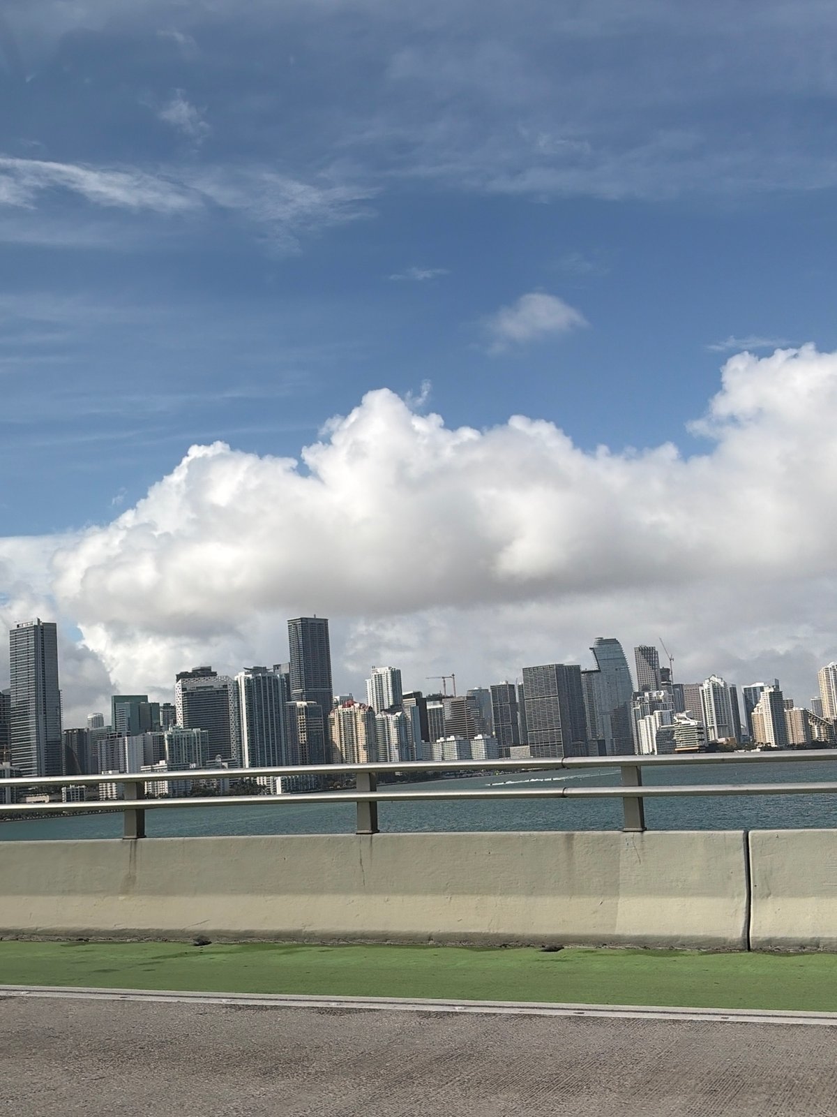 Miami skyline viewed from bridge on March evening