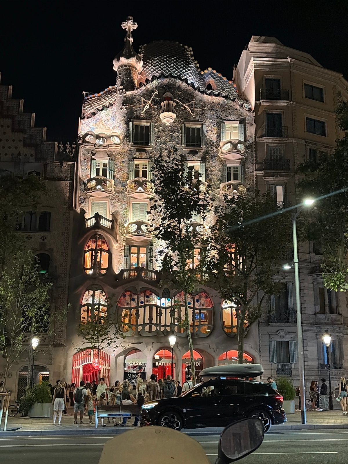 Casa Batlló glowing at night on Passeig de Gràcia