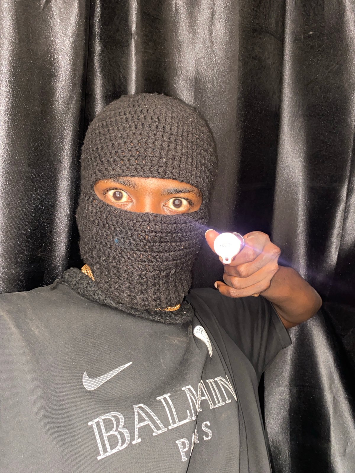 Masked individual photographed repeatedly in Nigeria morning session
