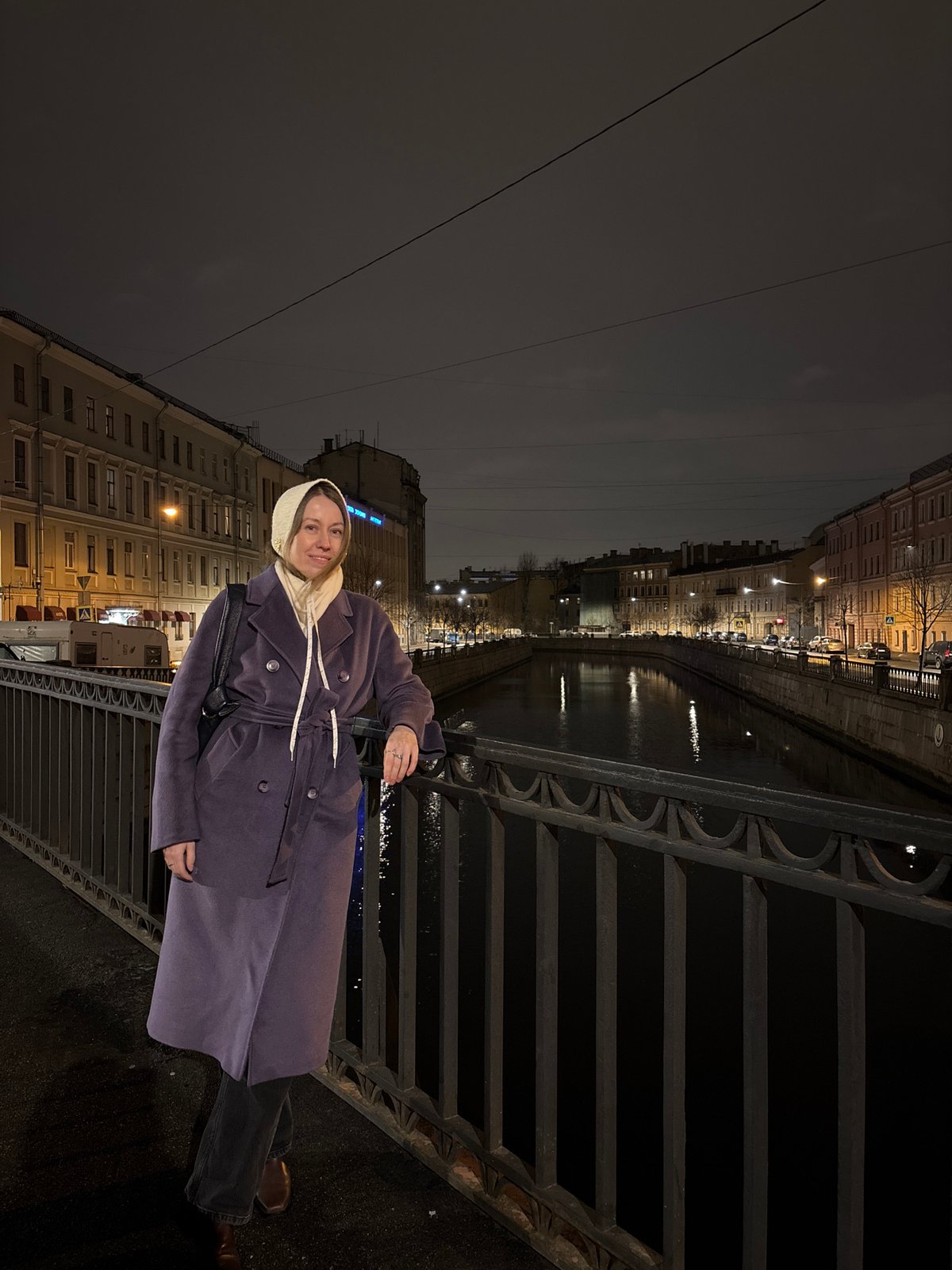 Woman in purple coat spotted on Saint Petersburg bridge