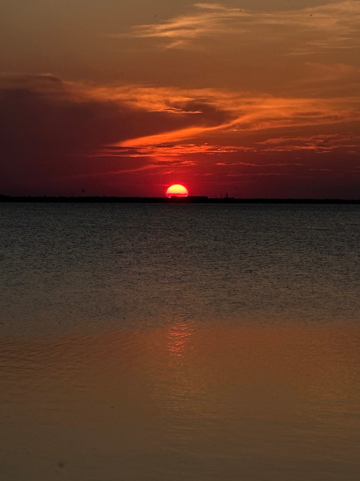 Evening scenes documented across Kokshetau including sunset sailing, urban walkways