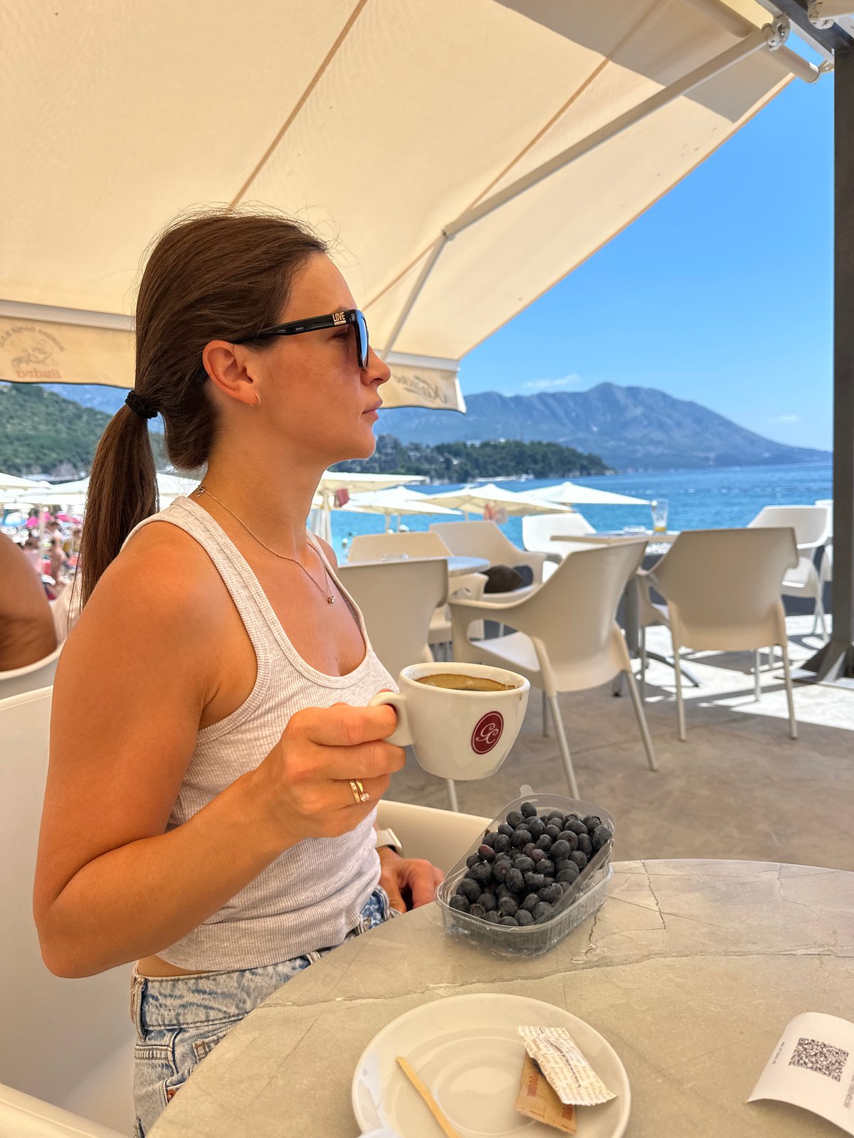 Lazy summer morning on the Budva coast, café to shoreline