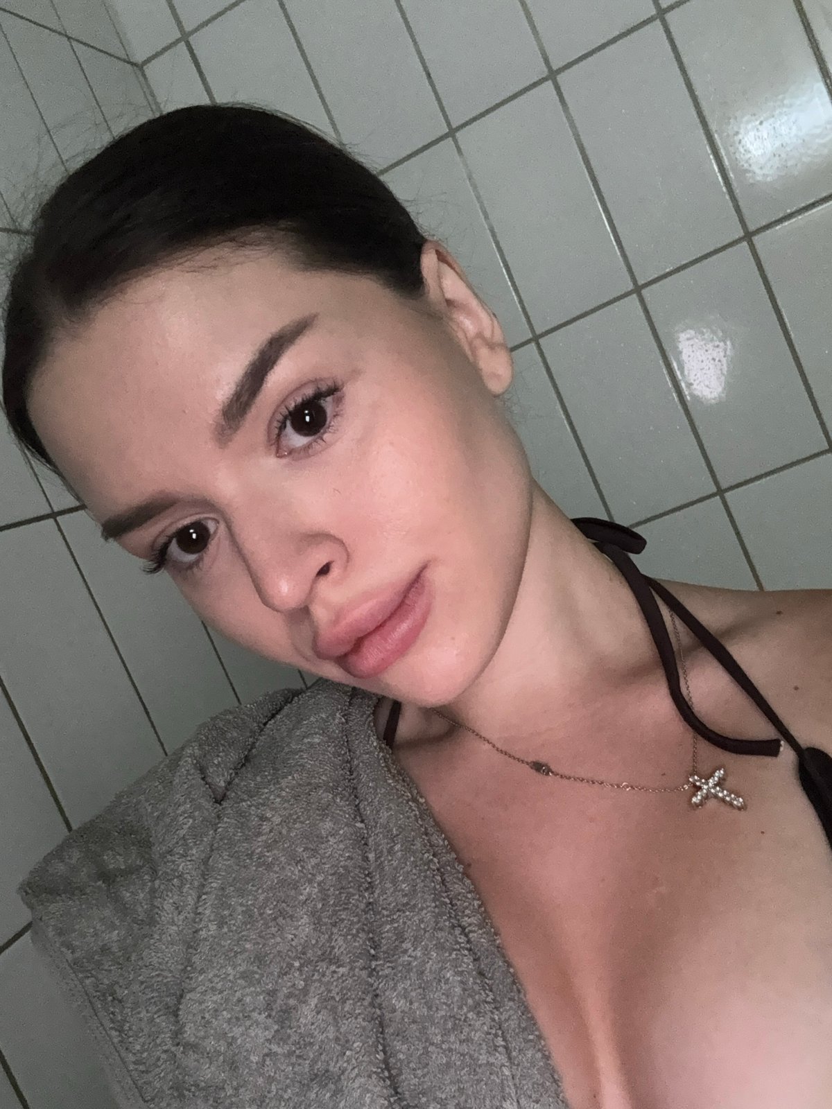 Bathroom selfies in a Prague shower stall, summer 2026.