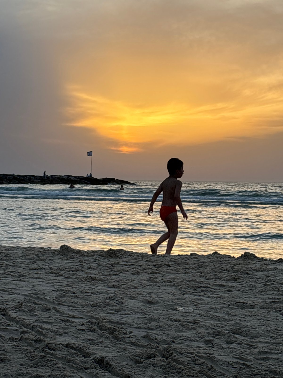 Sunset beach scene captured at Tel Aviv waterfront