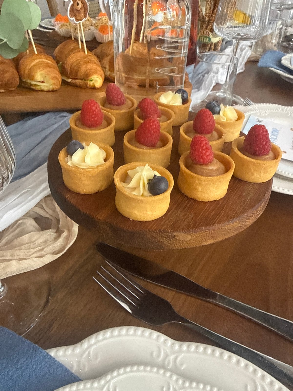 Baby shower table spread with pastries and floral decor, Sofia