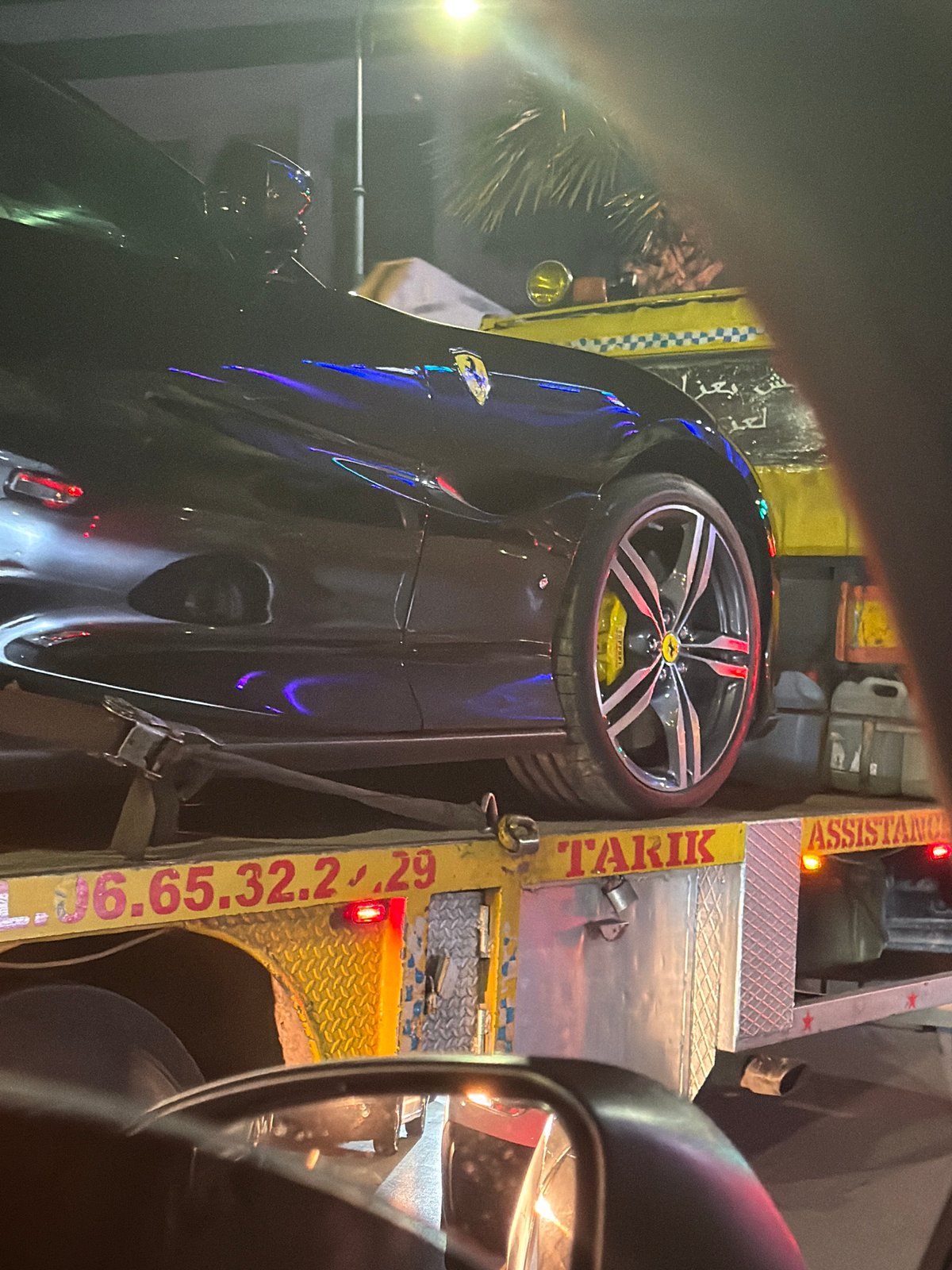 Ferrari towed by assistance truck in Meknes, Morocco
