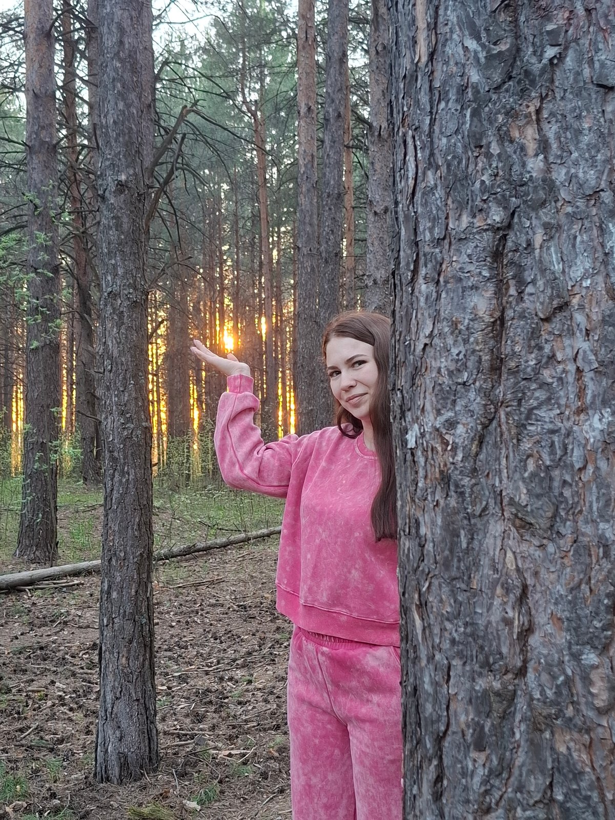 Woman jogs, takes selfies in Chaikovsky forest during afternoon