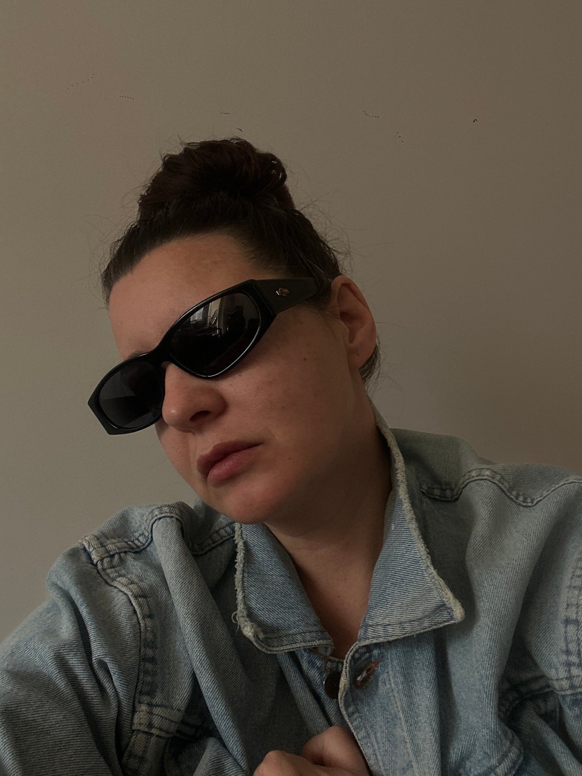 Person in denim jacket, sunglasses spotted in Riga