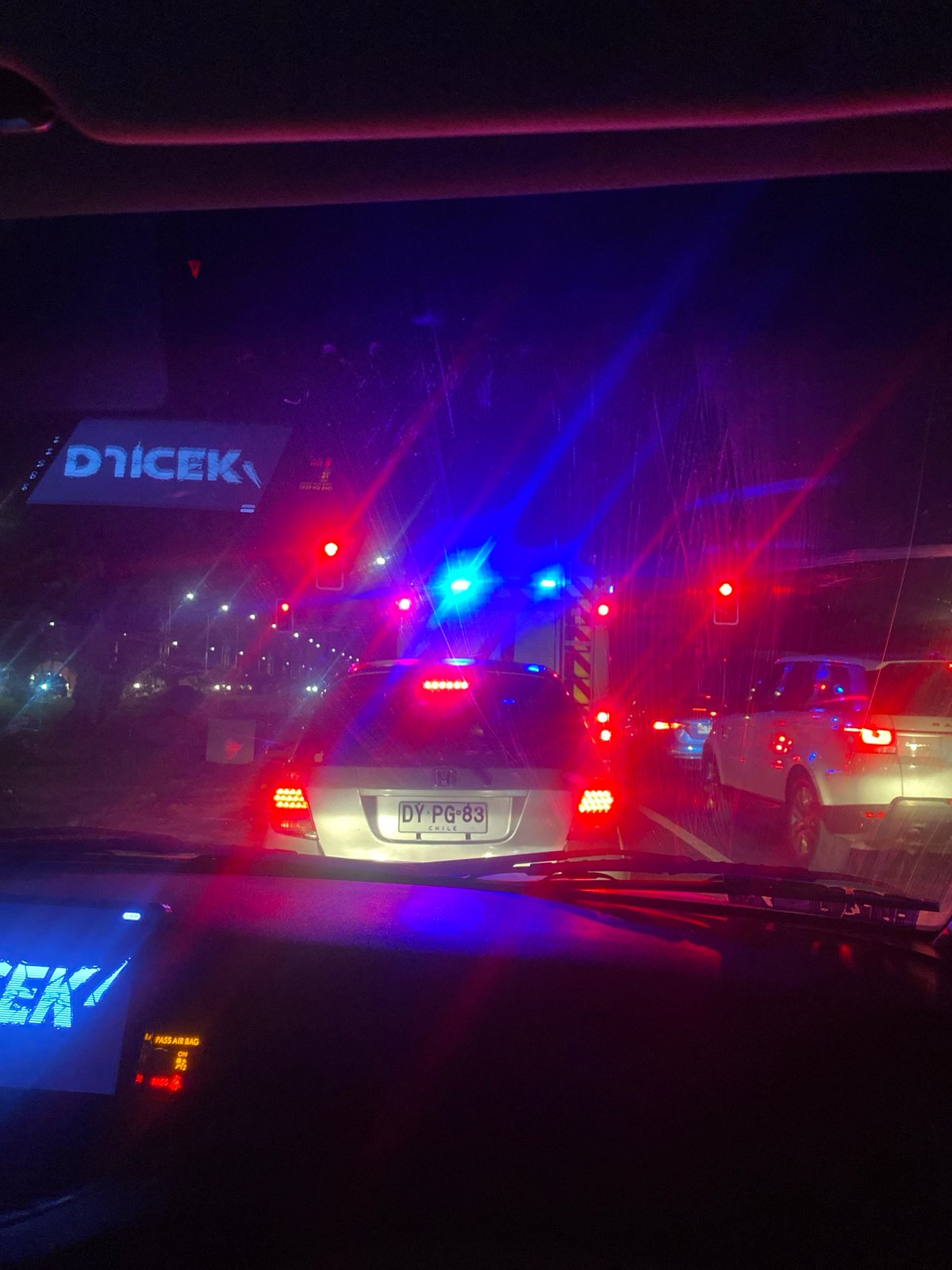 Emergency vehicle conducts nighttime traffic stop in Arica, Chile