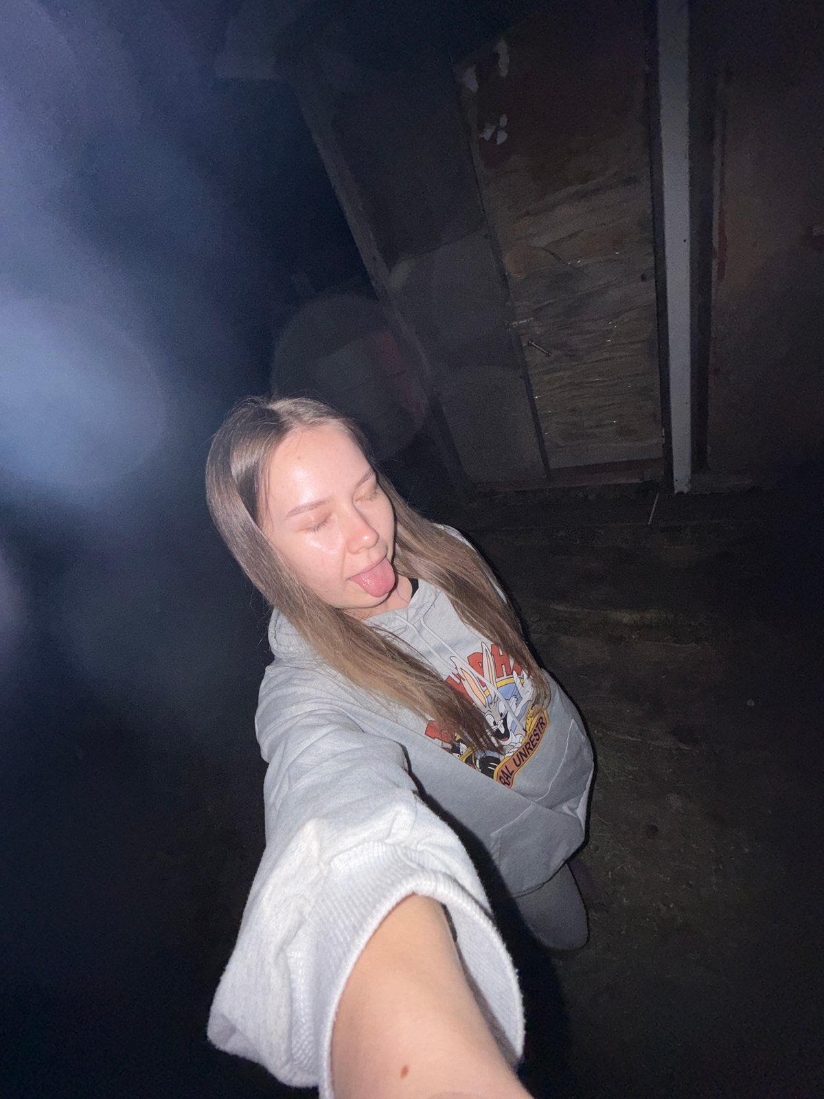 Woman documents evening selfie session in Zhigalki, Russia