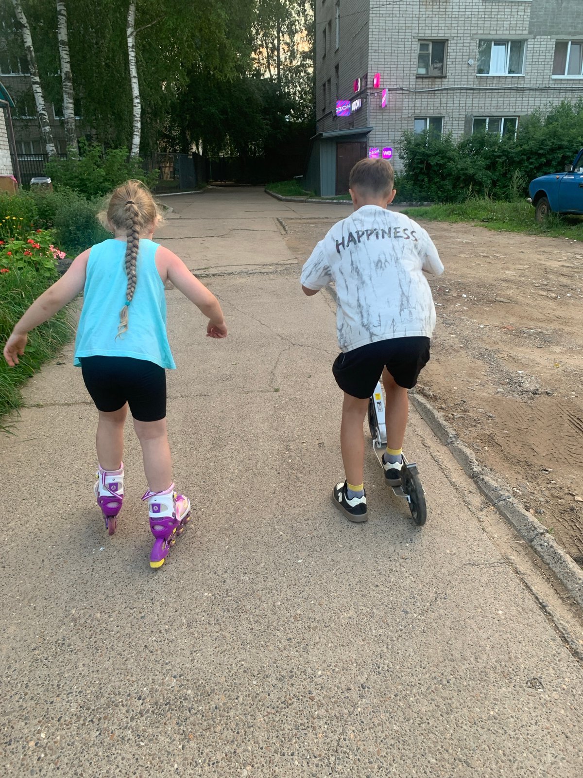 Kids' summer afternoon near apartment blocks in Chaikovsky