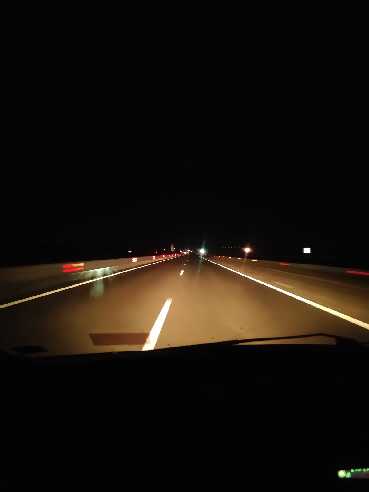 Late-night highway drive through wet roads in rural Bulgaria